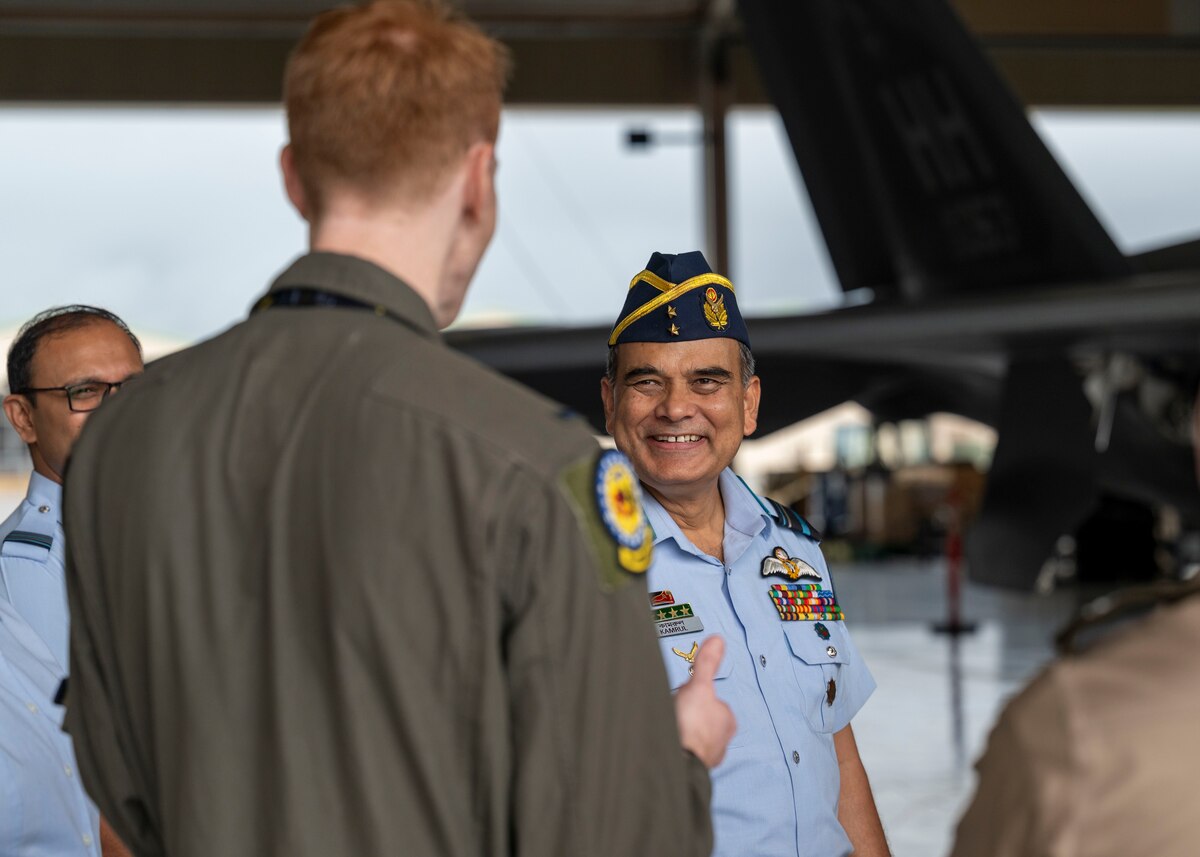 Photo of Bangladesh Air Force Air Vice Marshal speaking with a U.S. Air Force pilot