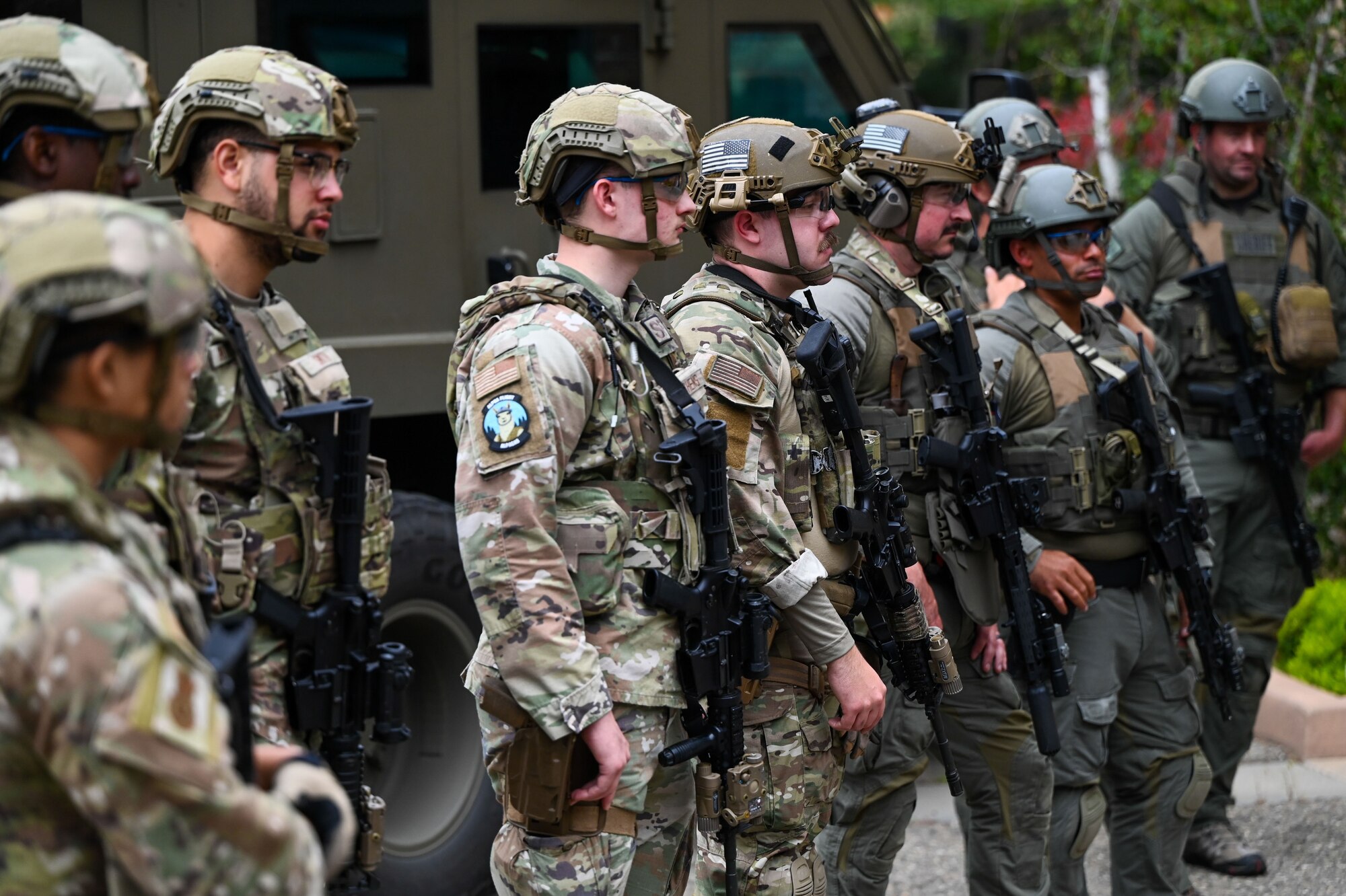 Defenders and Sheriffs stand together during a debrief.