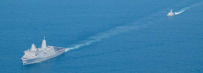 U.S. Navy San Antonio-class amphibious transport dock ship USS Somerset (LPD 25) (left) and Indonesian Navy Sampari-class fast attack craft KRI Kerambit (627) transit in formation