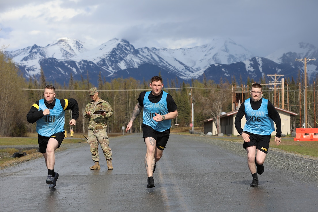 From the left, Alaska Army National Guard Pfc. Colton Cowan, Spc. Patrick Deslaurier, and Spc. Loren McDole, sprint from the starting line during a quarter-mile race as part of the AKARNG’s State Best Warrior Competition at Camp Carroll on Joint Base Elmendorf-Richardson, May 14, 2024. Cowan is an infantryman assigned to the Alpha Company, 1st Battalion 297th Infantry Regiment and his fellow Soldiers are both assigned to the 49th Missile Defense Battalion at Ft. Greely, Alaska.