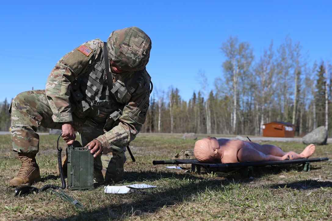 Alaksa Army National Guard Sgt. Alvira Ramos, a wheeled vehicle mechanic assigned to the 49th Missile Defense Battalion, assembles a Single Channel Ground and Airborne Radio System (SINCGARS) to call in a simulated 9-line medical evacuation during the AKARNG’s State Best Warrior Competition at Camp Carroll on Joint Base Elmendorf-Richardson, May 15, 2024.