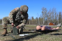 Alaksa Army National Guard Sgt. Alvira Ramos, a wheeled vehicle mechanic assigned to the 49th Missile Defense Battalion, assembles a Single Channel Ground and Airborne Radio System (SINCGARS) to call in a simulated 9-line medical evacuation during the AKARNG’s State Best Warrior Competition at Camp Carroll on Joint Base Elmendorf-Richardson, May 15, 2024.