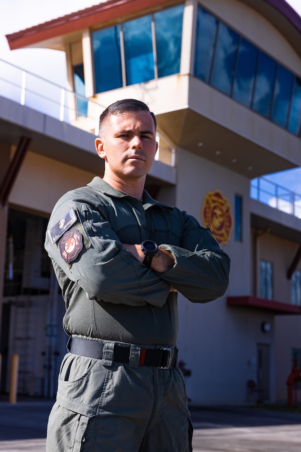 U.S. Marine Corps Gunnery Sgt. David Waterfield, Jr., fire officer, Aircraft Rescue and Firefighting, Marine Corps Air Station Kaneohe Bay, poses for a photo in front of the MCAS Kaneohe Bay fire station, Marine Corps Base Hawaii, April 18, 2024. Waterfield was recently named the 2023 Marine Corps Fire and Emergency Services Military Fire Officer of the Year. According to MARADMIN 182/24, winners were selected based on their resourcefulness, initiative, and selfless dedication to duty. (U.S. Marine Corps photo by Sgt. Brandon Aultman)