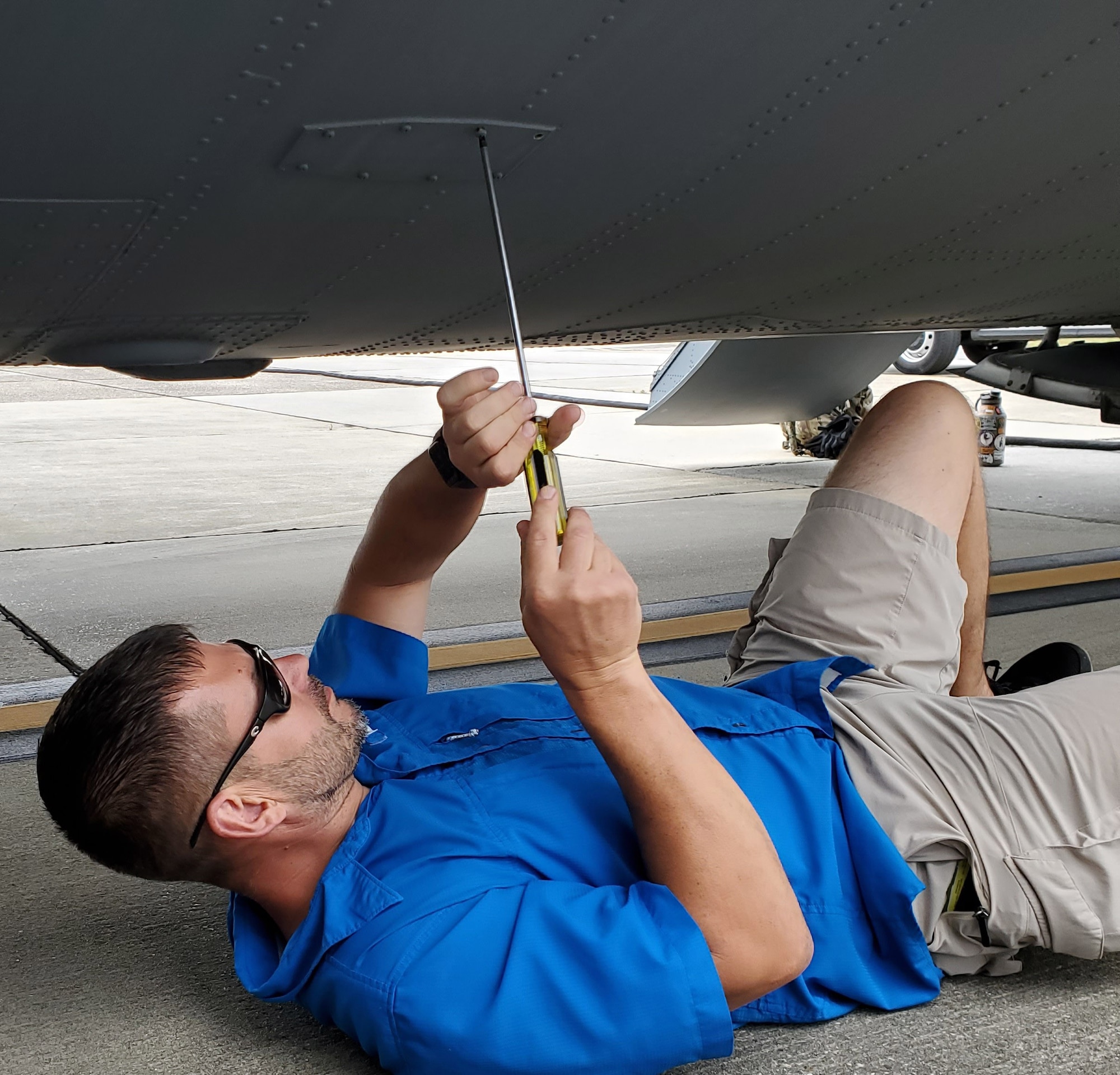 Guy removing part from aircraft at Keesler AFB