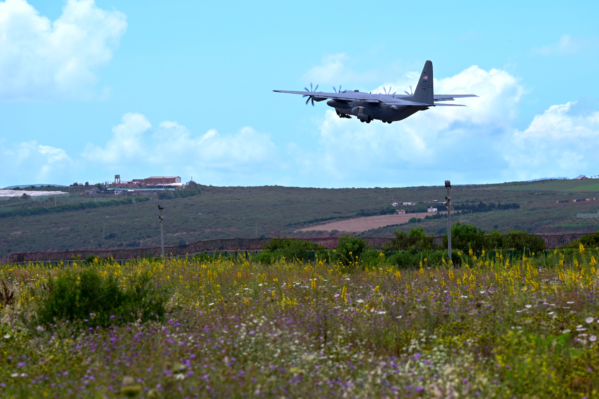 A U.S. Air Force C-130H3 Hercules assigned to Peterson Space Force Base, takes off during exercise African Lion 24 at Kenitra Air Base, Morocco, May 19, 2024. The 302nd AW will conduct a joint forcible entry exercise as well as cargo drop operations during this exercise.  Airborne insertions allow aircrew to sharpen vital airdrop skills as they rapidly and safely drop the maximum number of personnel at a specific location. (U.S. Air Force photo by Senior Airman Jenna A. Bond)