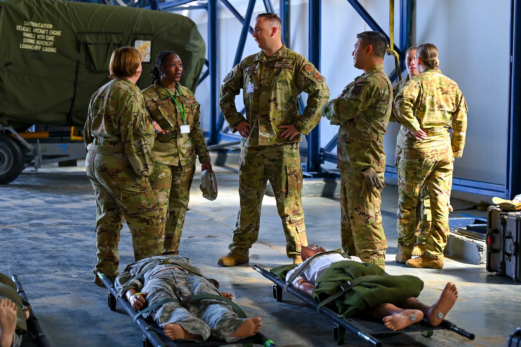 U.S. Air Force aeromedical evacuators assigned to Ramstein Air Force Base’s 86th Aeromedical Evacuation Squadron, determine where to set up their equipment during exercise African Lion 2024 (AL24) at Kenitra Air Base, Morocco, May 18, 2024. AL24 is U.S. Africa Command’s largest, combined, joint exercise. This year marks the 20th anniversary of U.S. Africa Command’s premier joint exercise led by U.S. Army Southern European Task Force, Africa (SETAF-AF), running from April 19 to May 31 across Ghana, Morocco, Senegal and Tunisia.  (U.S. Air Force photo by Senior Airman Jenna A. Bond)