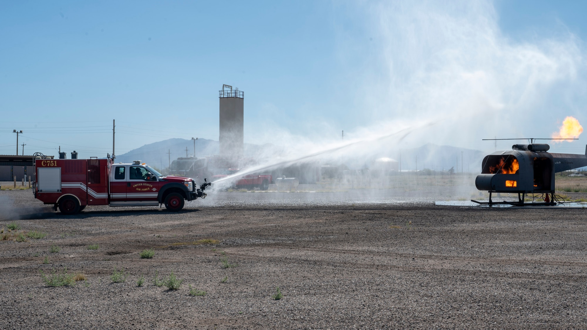 U.S. Airmen assigned to the 355th Civil Engineering Squadron extinguish a simulated HH-60 aircraft fire during the Mission Support Group Phase II training exercise at Davis-Monthan Air
Force Base, Ariz., May 13, 2024. The MSG exercise provided vital training opportunities for Airmen to be prepared to operate in contested environments. (U.S. Air Force photo by Airman 1st Class William Finn V)