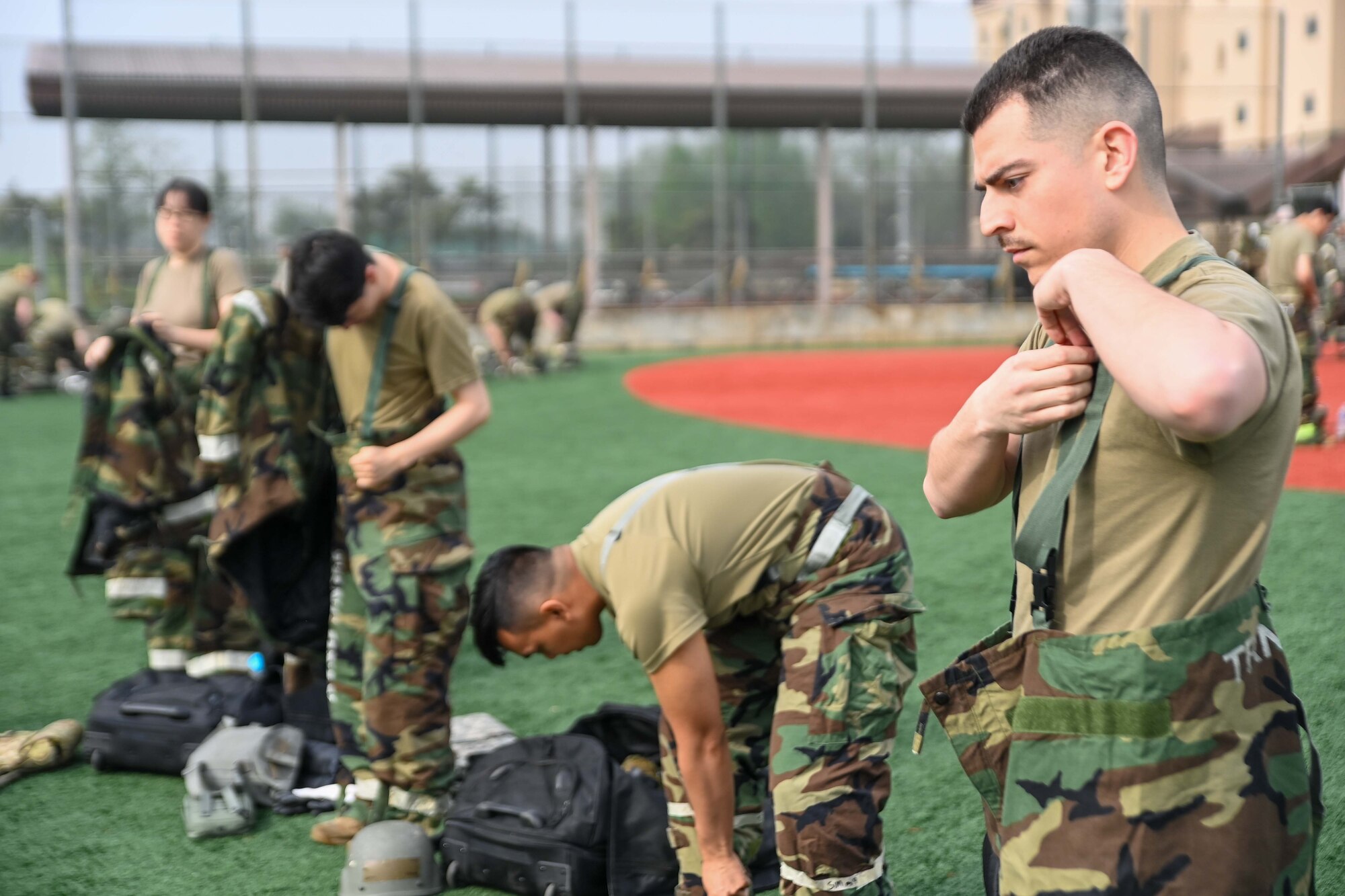 694th Intelligence, Surveillance and Reconnaissance Group Airmen don Mission Oriented Protective Posture gear during an Ability to Survive and Operate rodeo at Osan Air Base, Republic of Korea, April 26, 2024.