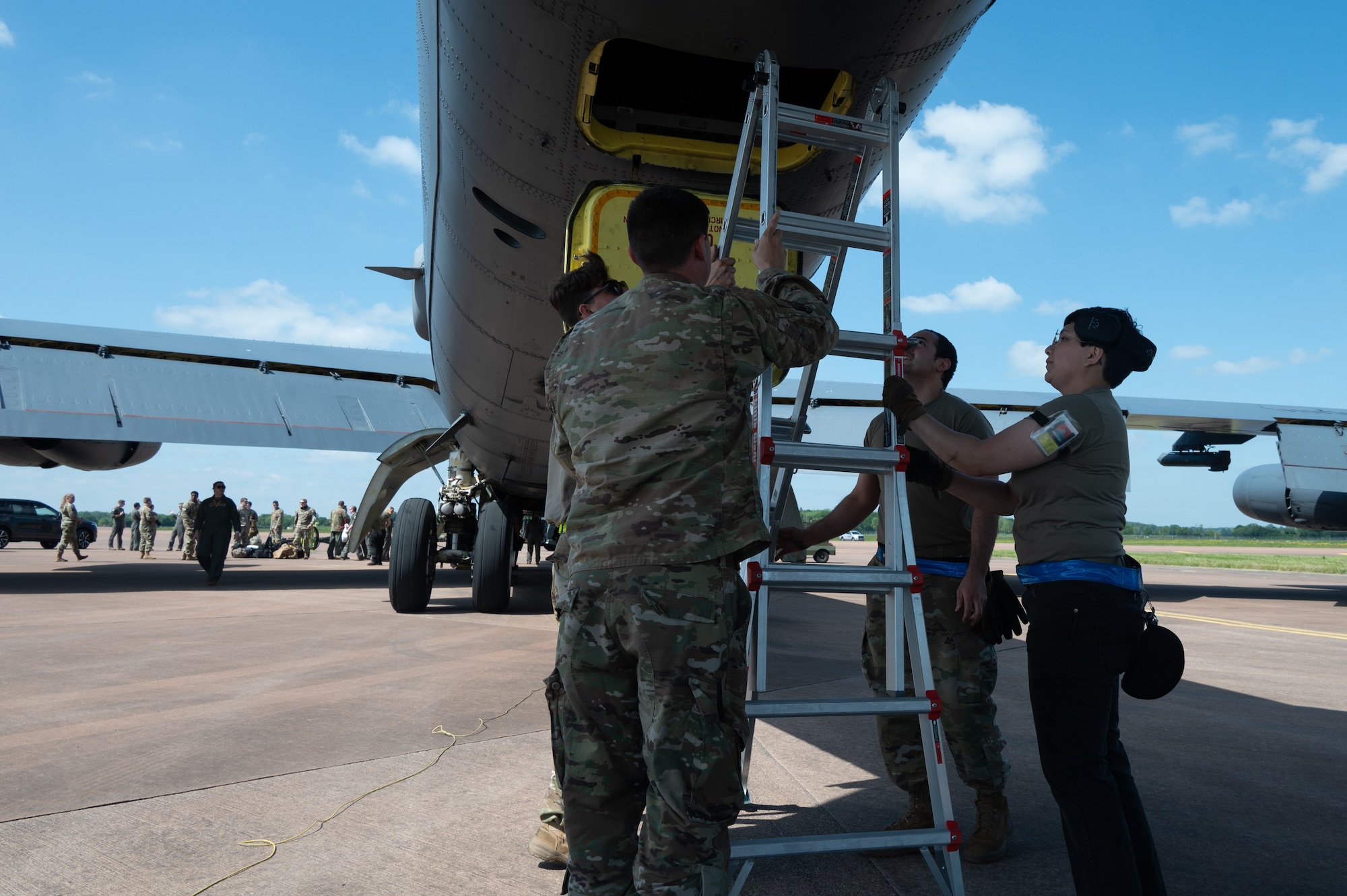 Airmen prepare to unload luggage from a B-52 Stratofortress.