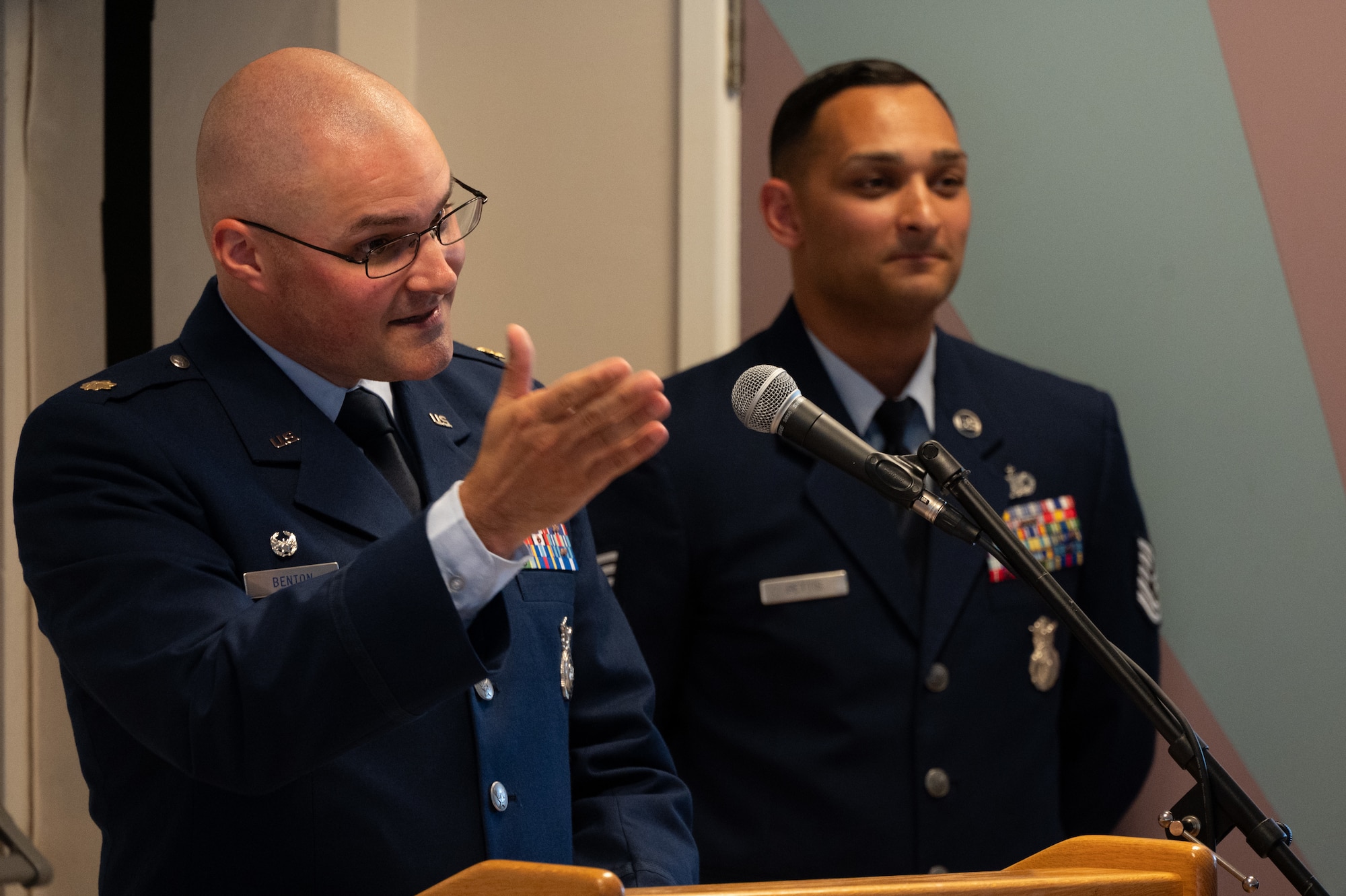 U.S. Air Force Maj. Kendall P. Benton, 422d Security Forces Squadron commander, gives a speech.