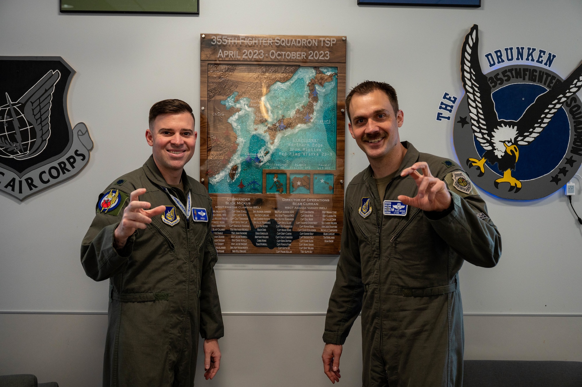 U.S. Air Force Lt. Col. Erik Gonsalves (left), 355th Fighter Squadron incoming commander, and Lt. Col Michael Mickus, 355th FS outgoing commander, pose for a photo at Eielson Air Force Base, Alaska, May 17, 2024.