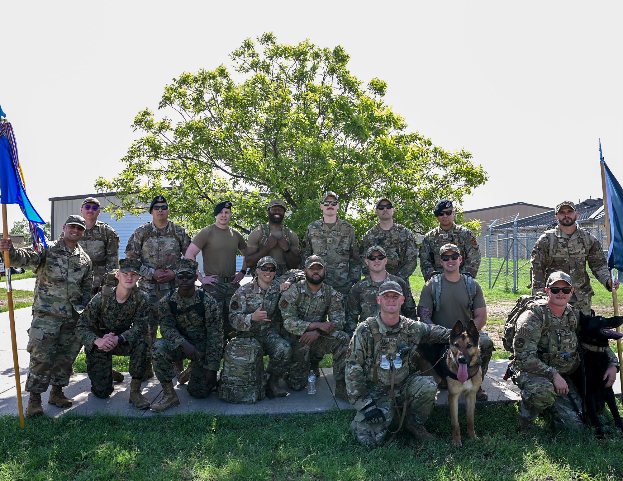17th Security Forces Squadron defenders pose for a group photo after part in a ruck march for National Police Week at Goodfellow Air Force Base, May 13, 2024. Airmen were rucking to pay their respects to fallen law enforcement officers and symbolize carrying on their legacy. (U.S. Air Force photo by Airman 1st Class Evelyn J. D’Errico)