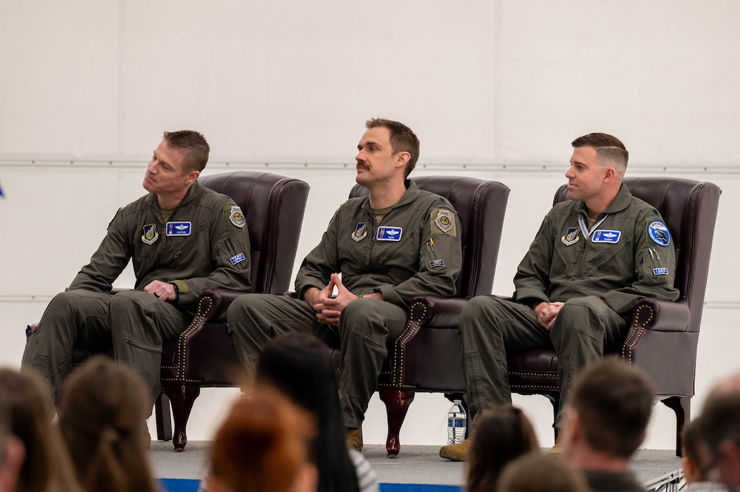 U.S. Air Force Col. Curtis Dougherty (left), 354th Operations Group commander, Lt. Col Michael Mickus (middle), 355th Fighter Squadron outgoing commander, and Lt. Col. Erik Gonsalves, 355th FS incoming commander, listen to opening remarks during a change of command ceremony at Eielson Air Force Base, Alaska, May 17, 2024.
