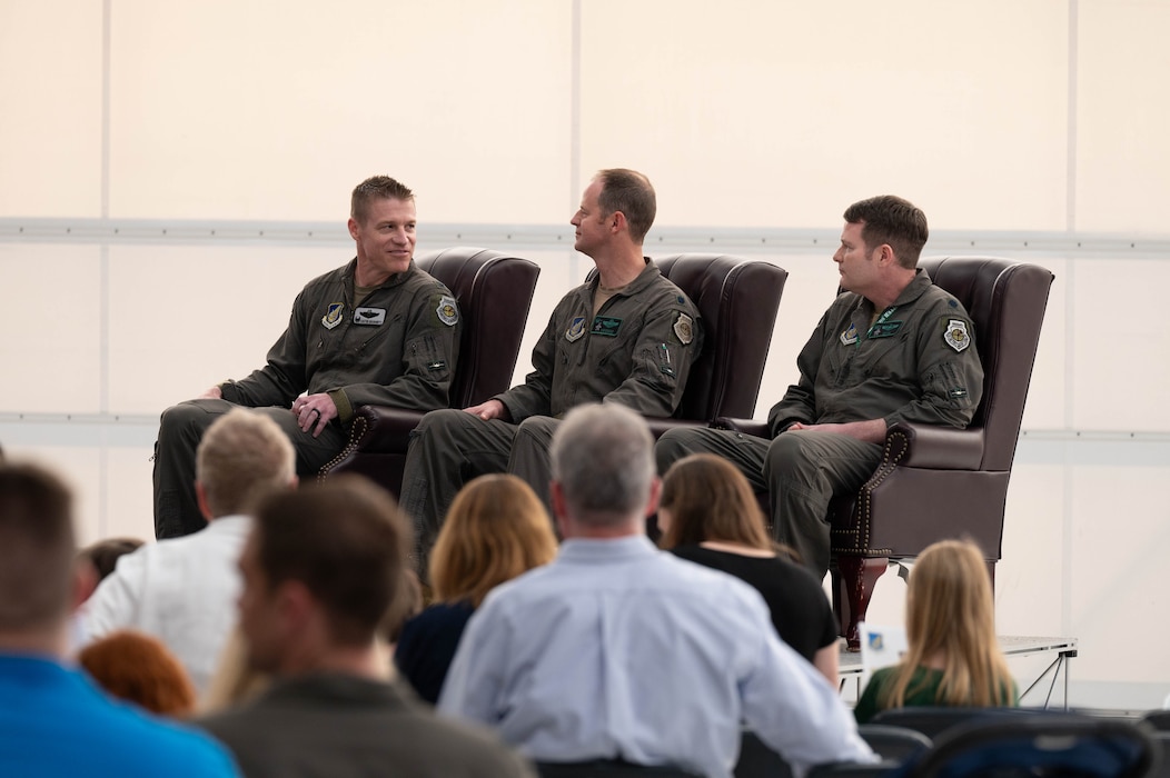 U.S. Air Force Col. Curtis Dougherty (left), 354th Operations Group commander, Lt. Col. Ryan Worrell (middle), 356th Fighter Squadron outgoing commander, and Lt. Col. Joseph Curran, 356th FS incoming commander, listen to opening remarks during a change of command ceremony at Eielson Air Force Base, Alaska, May 17, 2024.