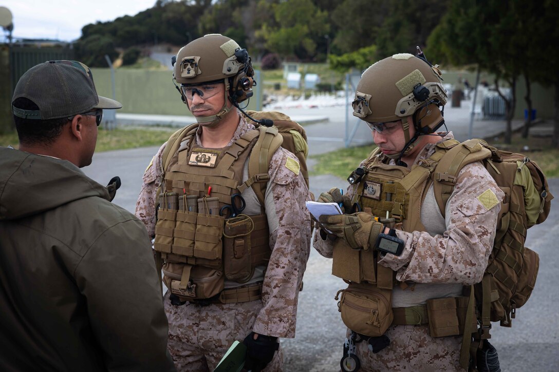 U.S. Marines Sgt. Tyler Severns and Sgt. Bryan Aguilar, explosive ordnance disposal technicians with Combat Logistics Battalion 8, Combat Logistics Regiment 2, 2nd Marine Logistics Group, speak with a roleplayer during a simulated cache call during exercise EFES-24 and Marine Rotational Force Europe (MRF-E) 24.2 at Özbek, Türkiye, on May 11, 2024. EFES-24 is an international combined joint exercise focused on increasing force readiness, promoting stability and prosperity in the region, and interoperability between the U.S., Turkey, and allied nations. MRF-E focuses on regional engagements throughout Europe by conducting various exercises, mountain-warfare training, and military-to-military engagements, which enhances the overall interoperability of the U.S. Marine Corps with allies and partners. (U.S. Marine Corps Photo by Cpl. Jackson Kirkiewicz)