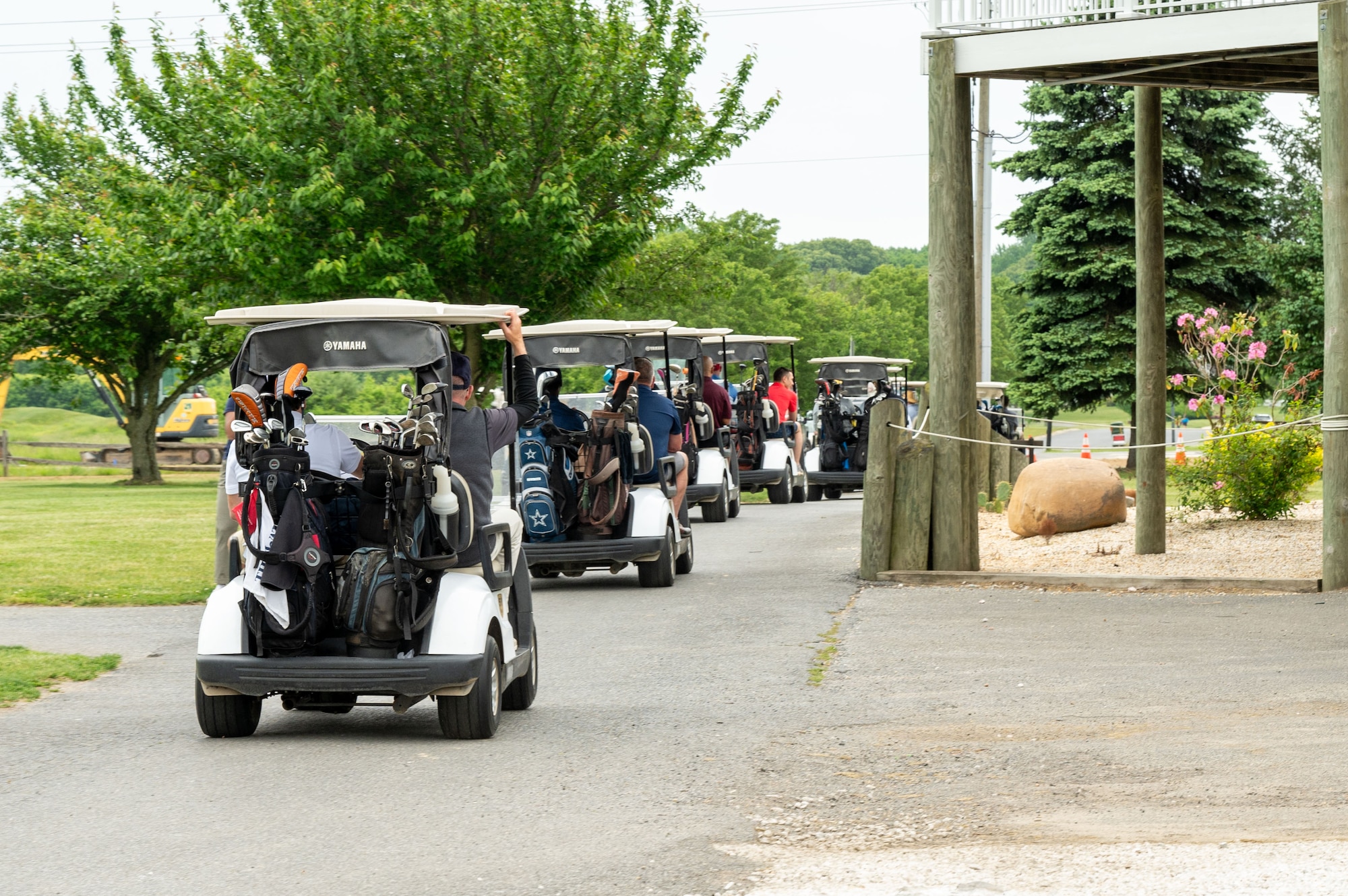 Golfers drive off as the Bluesuiters Golf Tournament begins at Jonathan’s Landing Golf Course in Magnolia, Delaware, May 9, 2024. Bluesuiters is a biannual golf tournament connecting Team Dover Airmen with local civic and business leaders from the community. (U.S. Air Force photo by Airman Liberty Matthews)