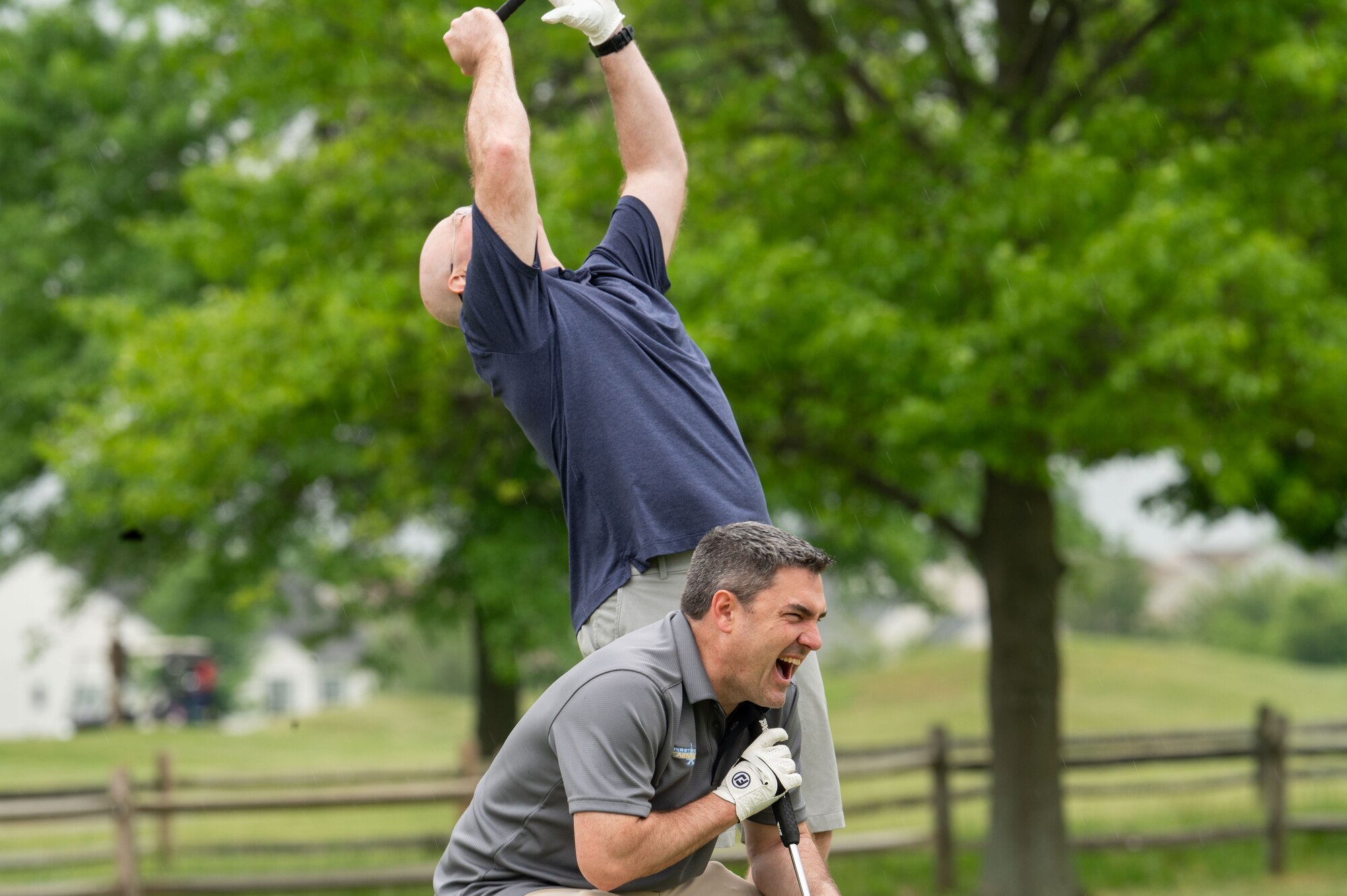 U.S. Air Force Cols. Chris McDonald, 436th Airlift Wing commander, above, and Rusty Gohn, 436th Airlift Wing deputy commander, below, express frustration at Jonathan’s Landing Golf Course in Magnolia, Delaware, May 9, 2024. At the event, Team Dover Airmen were sponsored by local civic and business leaders so that they could play in the tournament. (U.S. Air Force photo by Airman Liberty Matthews)