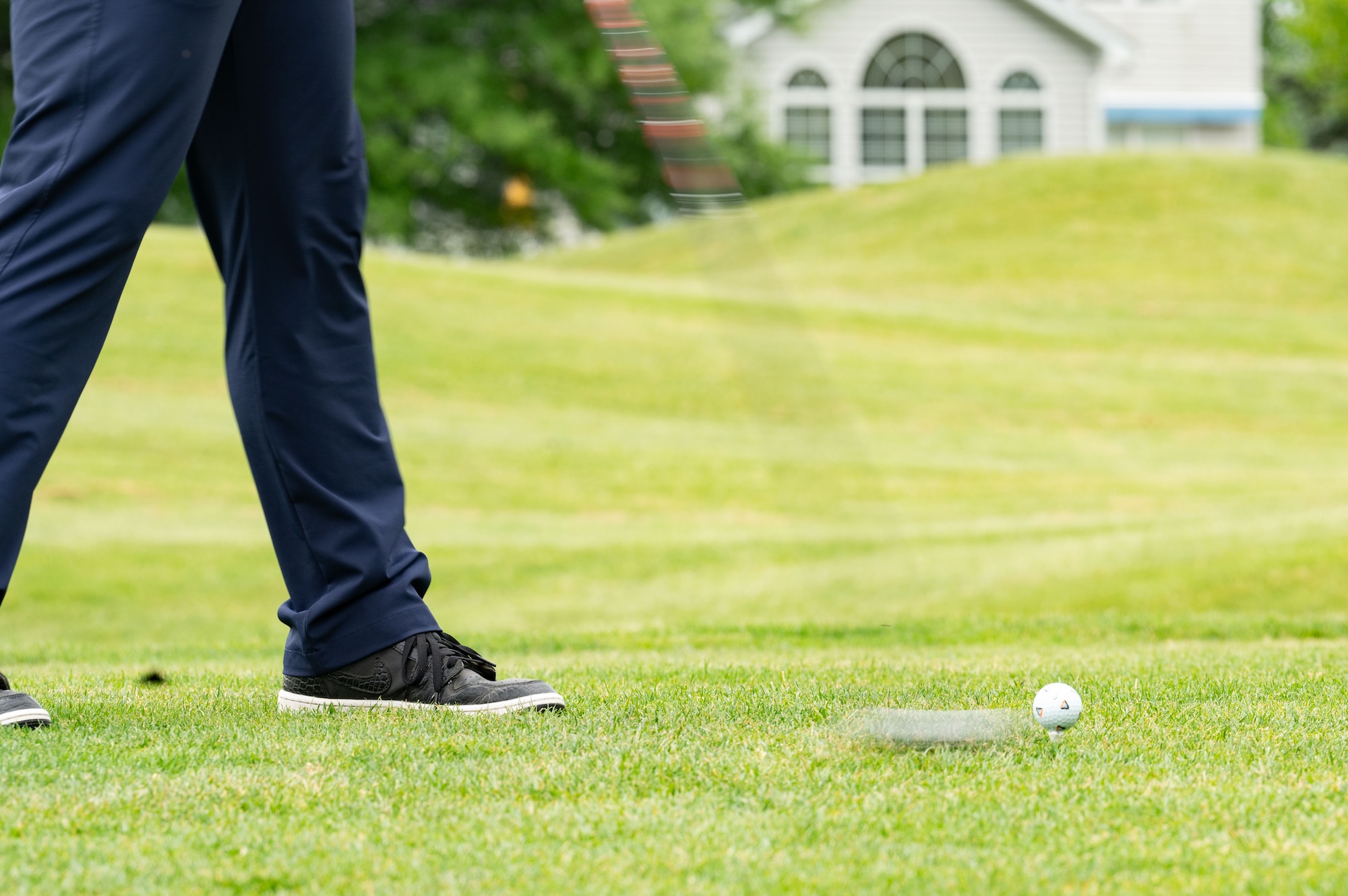 A Team Dover member drives the ball at Jonathan’s Landing Golf Course in Magnolia, Delaware, May 9, 2024. Bluesuiters is a biannual golf tournament connecting Team Dover Airmen with local civic and business leaders from the community. (U.S. Air Force photo by Airman Liberty Matthews)