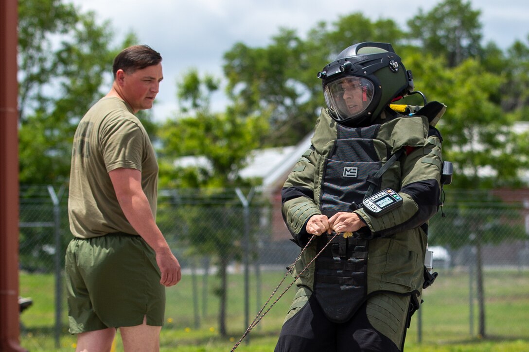 U.S. Marine Corps Staff Sgt. Dominick Casanova an Explosive Ordnance Disposal (EOD), with 8th Engineer Support Battalion, 2nd Marine Logistics Group, competes in the bomb suit agility test during the 2024 Explosive Ordnance Disposal (EOD) Team of the Year Competition on Camp Lejeune, North Carolina, May 20, 2024. U.S. Marines, U.S. Army and U.S. Air Force EOD Technicians from across the United States, participated in a joint competition hosted by 8th Engineer Support Battalion, 2nd Marine Logistics Group to test individual and team skills while enhancing camaraderie and Esprit de Corps across the joint EOD community. (U.S. Marine Corps photo by Christian Salazar)