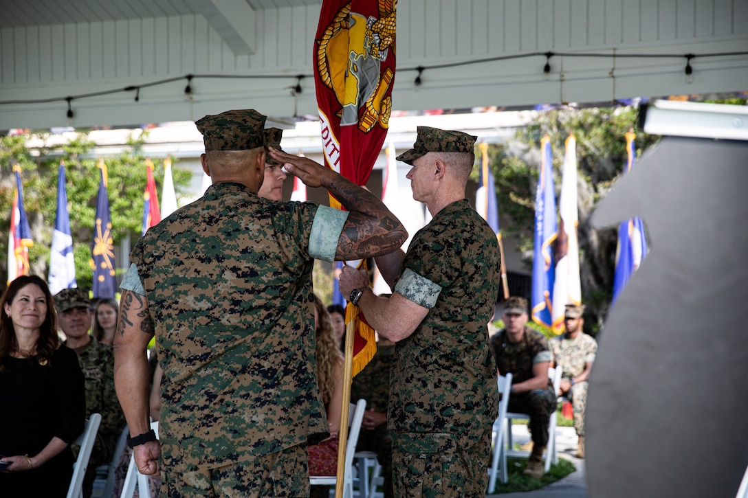 U.S. Marine Corps Brig. Gen. Andrew T. Priddy, right, relinquishes command of 2d Marine Expeditionary Brigade (MEB) to Brig. Gen. Samuel L. Meyer, the incoming commanding general of 2d MEB, left, during the 2d MEB change of command ceremony at Marine Corps Base Camp Lejeune, North Carolina, May 16, 2024. The role of 2d MEB’s commanding general is to provide a scalable, standing, joint-capable, deployment-ready headquarters element to support II MEF operations abroad. (U.S. Marine Corps photo by Cpl. Noah Seal)