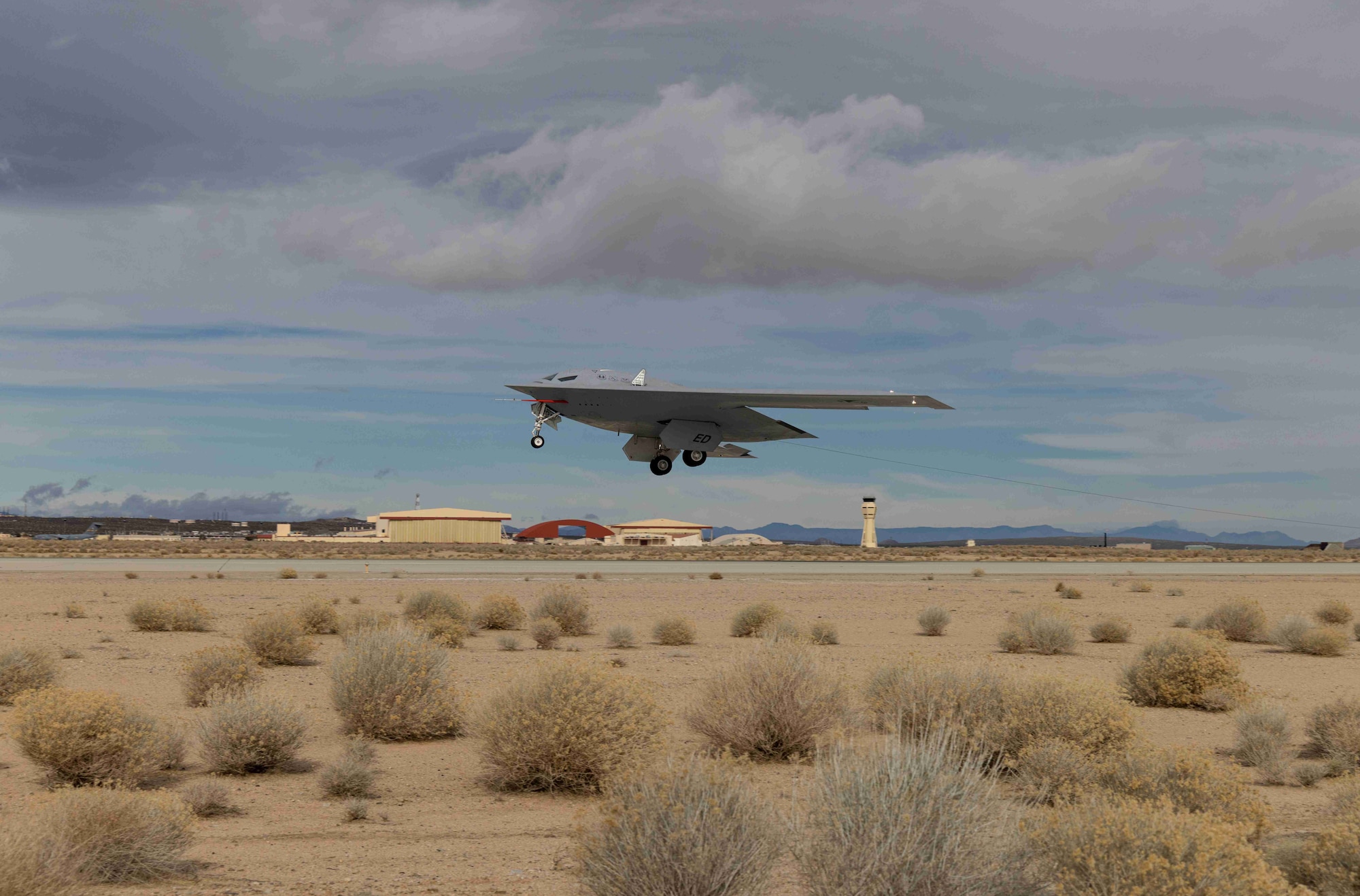 -A B-21 Raider conducts flight tests, which includes ground testing, taxiing, and flying operations, at Edwards Air Force Base, California, where it continues to make progress toward becoming the backbone of the U.S. Air Force bomber fleet. The B-21 will possess the range, access, and payload to penetrate the most highly-contested threat environments and hold any target around the globe at risk. The B-21 program is on track to deliver aircraft in the mid-2020s to Ellsworth Air Force Base, South Dakota, which will be the first B-21 main operating base and location for the B-21 formal training unit. (Courtesy photo)