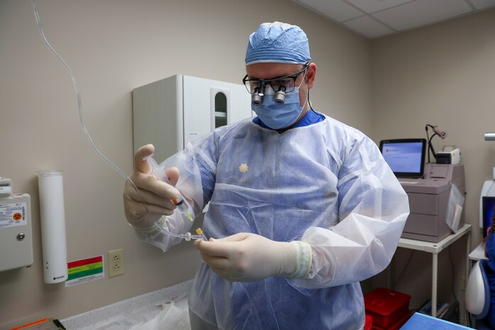U.S. Air Force Maj. Vladimir Vader, 9th Medical Group dental flight comprehensive dentist, provides intravenous sedation for a patient during a wisdom tooth extraction at Beale Air Force Base, California, March 27, 2024.