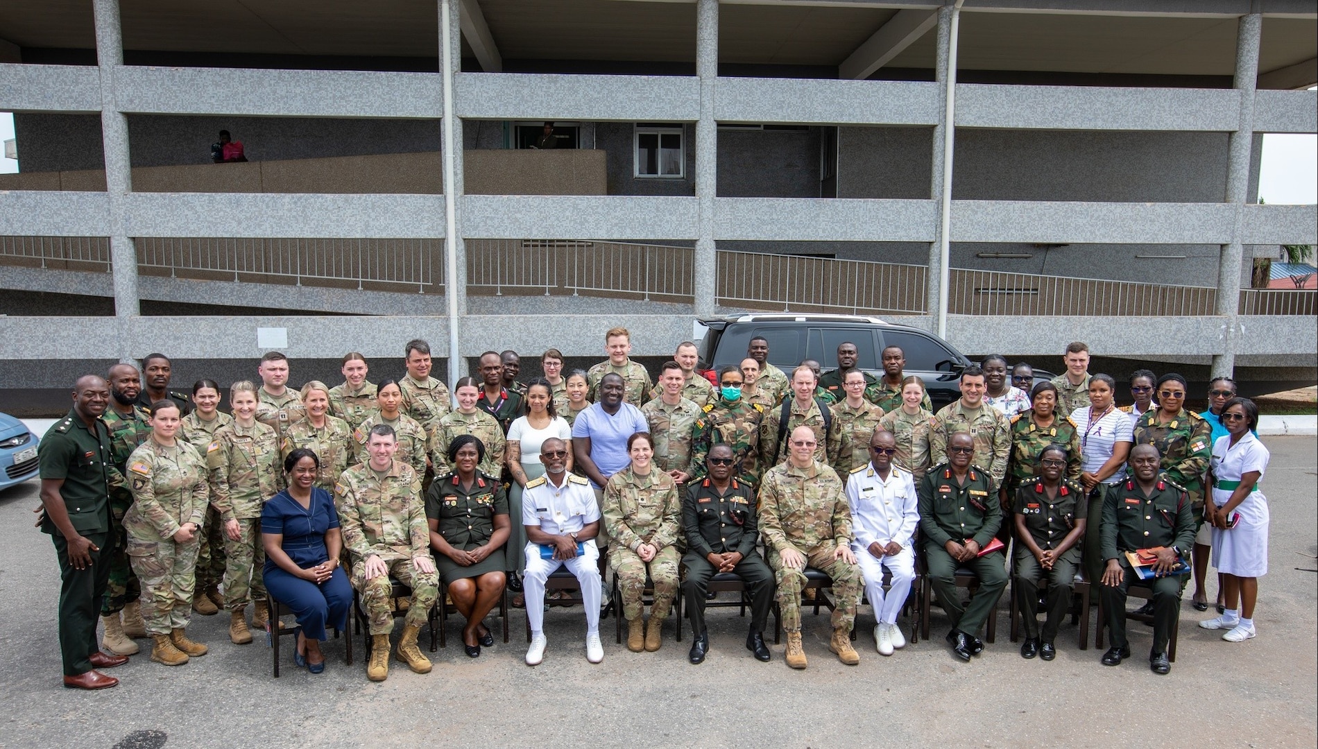 Members of the U.S. Army and Air Force and Ghana Armed Forces pose for a photo after the opening ceremony of a medical readiness exercise in Accra, Ghana, May 13, 2024. The exercise, planned and executed by U.S. Army Southern European Task Force, Africa, enables military health professionals from the United States and their African partners to share best practices.