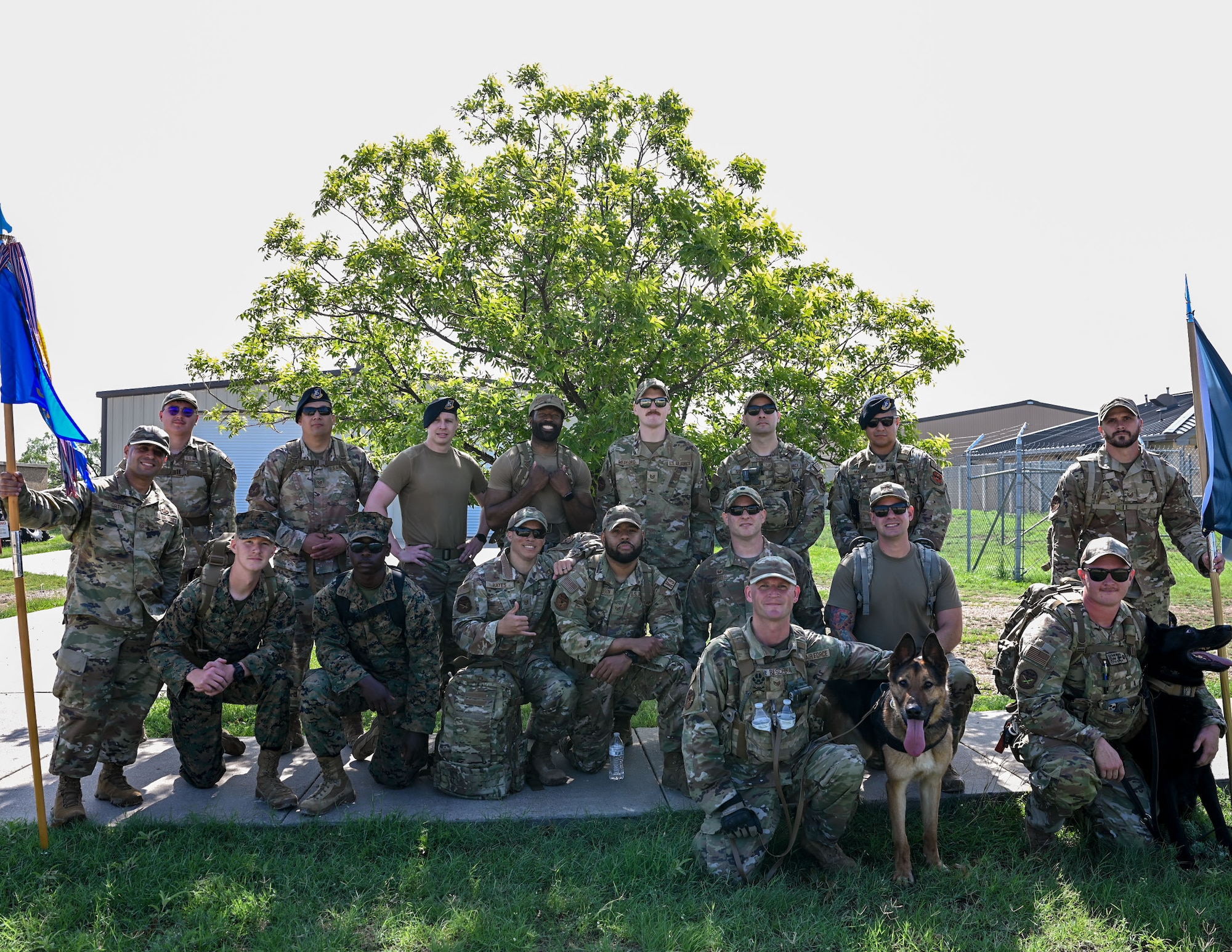 17th Security Forces Squadron defenders pose for a group photo after part in a ruck march for National Police Week at Goodfellow Air Force Base, May 13, 2024. Airmen were rucking to pay their respects to fallen law enforcement officers and symbolize carrying on their legacy. (U.S. Air Force photo by Airman 1st Class Evelyn J. D’Errico)