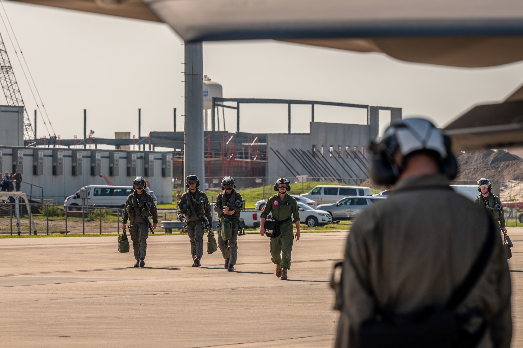 Marines walk on the flight line