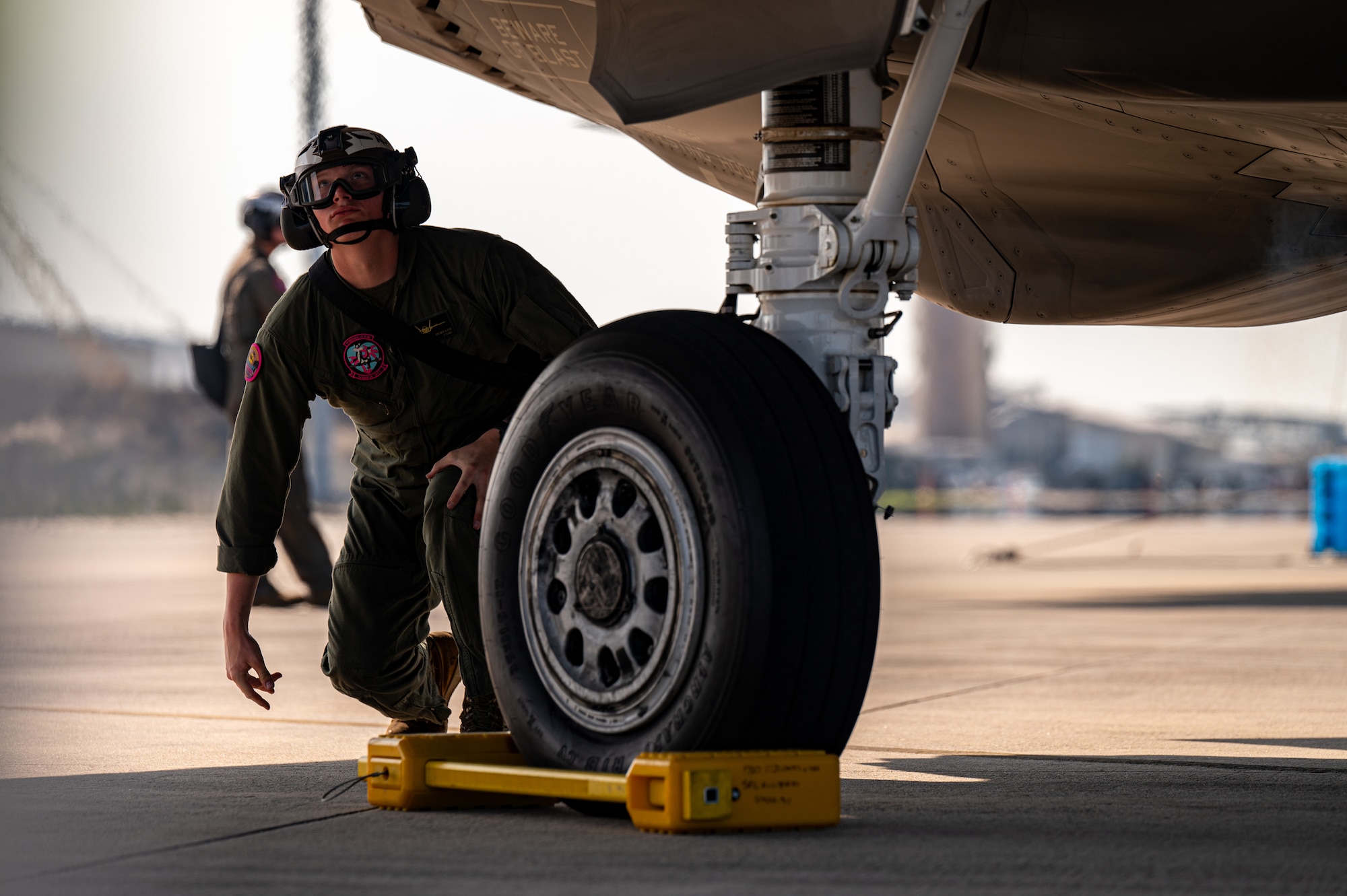 A marine examines an aircraft