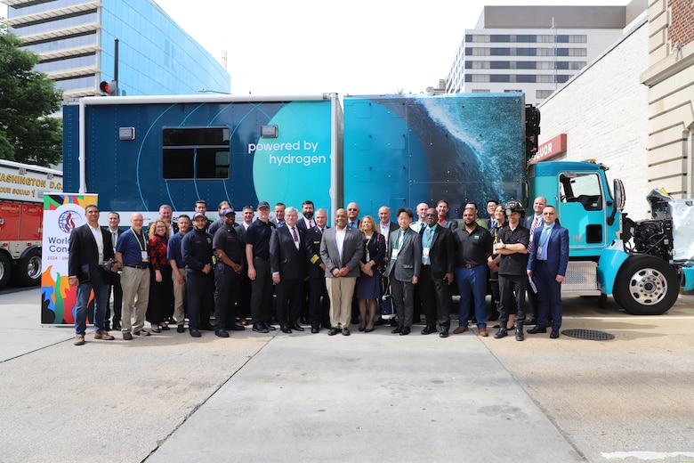 Global attendees in front of H2Rescue emergency response vehicle at World Fire Congress