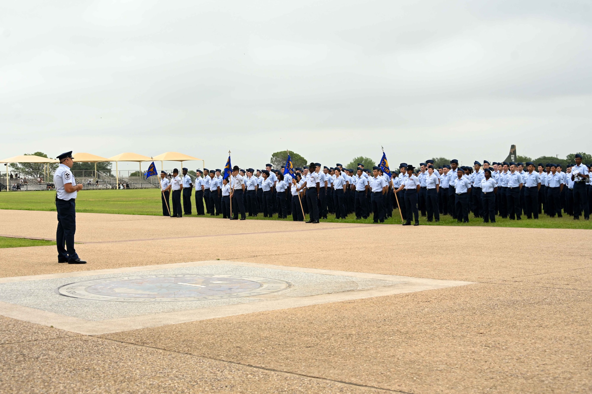 U.S. Air Force Chief Master Sgt. Justin Brundage, 97th Air Mobility Wing command chief, addresses graduating Airmen during the Air Force Basic Military Training (BMT) graduation at Joint Base San Antonio-Lackland, Texas, May 16, 2024. Brundage congratulated and encouraged the 494 graduating Airmen on their last official day of BMT. (U.S. Air Force photo by Senior Airman Kari Degraffenreed)