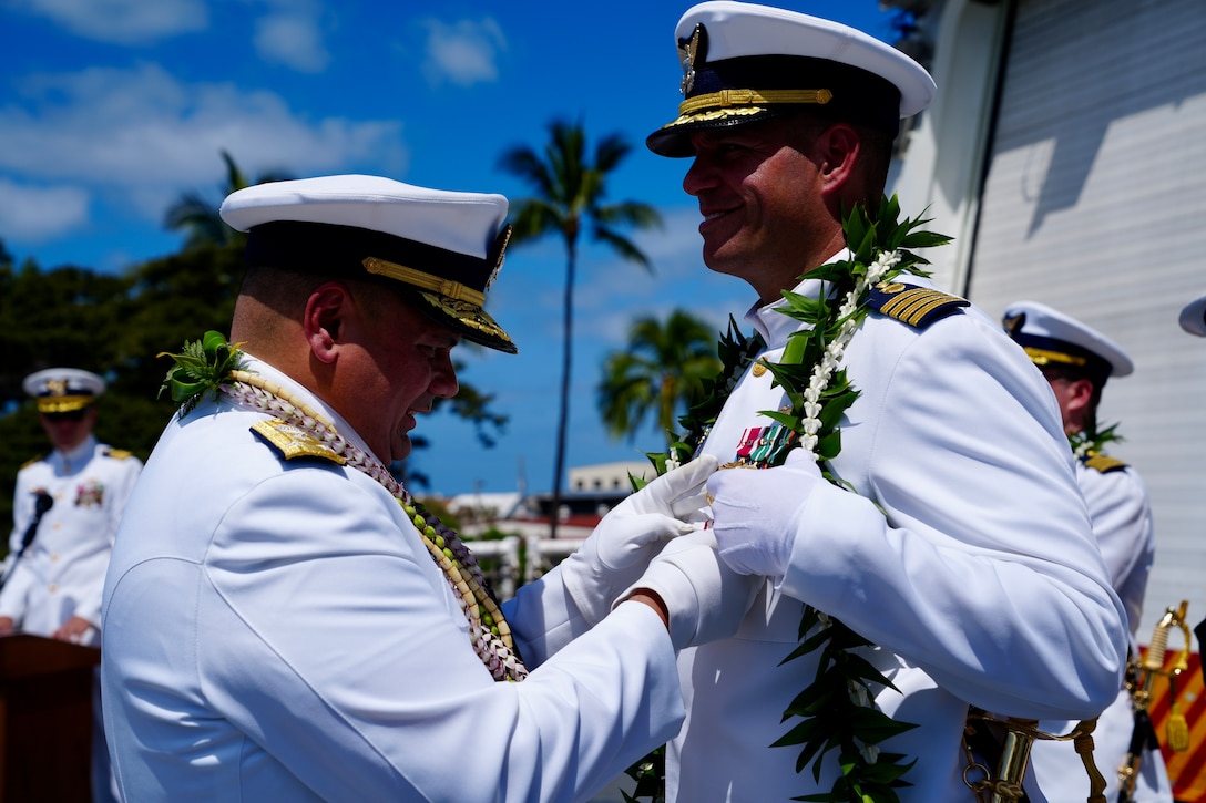 Vice Adm. Andrew Tiongson, Commander, U.S. Coast Guard Pacific Area and Defense Forces West, presents Capt. Robert Mohr with a meritorious service medal during the U.S. Coast Guard Cutter Waesche’s (WMSL 751) change of command ceremony aboard the cutter while moored at Base Honolulu, May 20, 2024. Capt. Tyson Scofield relieved Mohr as Waesche’s commanding officer during the ceremony. (U.S. Coast Guard photo by Petty Officer 3rd Class Jennifer Nilson)