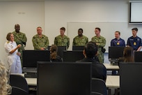 FREMANTLE, Western Australia (March 13, 2024) – U.S. Navy sailors assigned to the Los Angeles-class fast-attack submarine USS Annapolis (SSN 760) and Royal Navy sailors speak with students of South Metropolitan TAFE, Fremantle Campus, in Fremantle, Western Australia, March 13, 2024. The nuclear-powered, conventionally-armed submarine is in HMAS Stirling for the second visit by a fast-attack submarine to Australia since the announcement of the AUKUS (Australia, United Kingdom, United States) Optimal Pathway in March 2023. (U.S. Navy photo by Mass Communication Specialist 2nd Class Kaitlyn E. Eads)