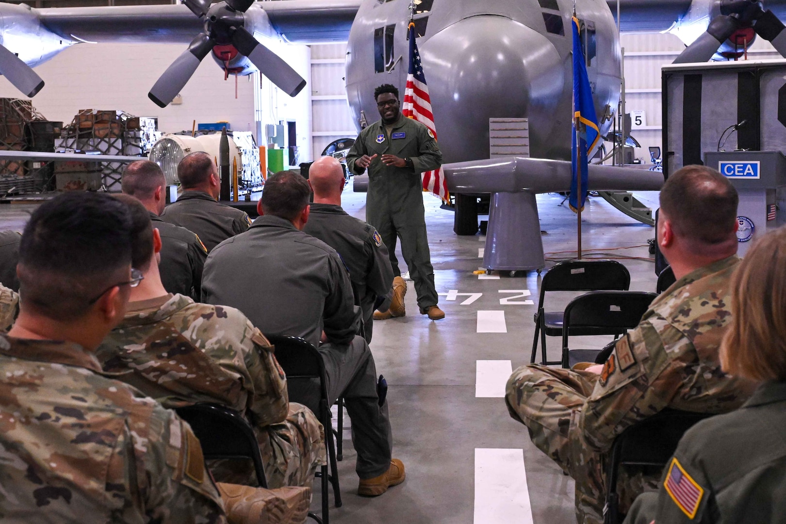 U.S. Air Force Master Sgt. Raheem Crockett, 344th Training Squadron basic loadmaster course instructor, briefs leaders from the 97th Air Mobility Wing on the loadmaster initial training course at the 37th Training Wing’s Career Enlisted Aviator Center of Excellence (CEA CoE) on Joint Base San Antonio-Lackland, Texas, May 14, 2024. The group of over 40 people toured CEA CoE to get a glimpse of what aircrew Airmen entering the boom operator and loadmaster schoolhouses, located at Altus Air Force Base, learn before stepping into Mobility’s Hometown. (U.S. Air Force photo by Senior Airman Kari Degraffenreed)