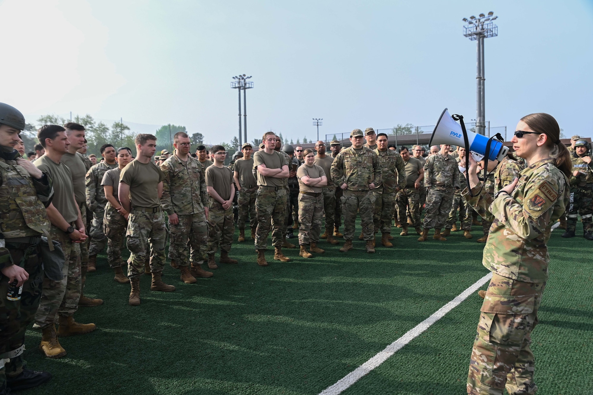 Chief Master Sgt. Christina Pagan, 694th Intelligence Support Squadron senior enlisted leader, addresses 694th Intelligence, Surveillance and Reconnaissance Group Airmen during an Ability to Survive and Operate rodeo at Osan Air Base, Republic of Korea, April 26, 2024.