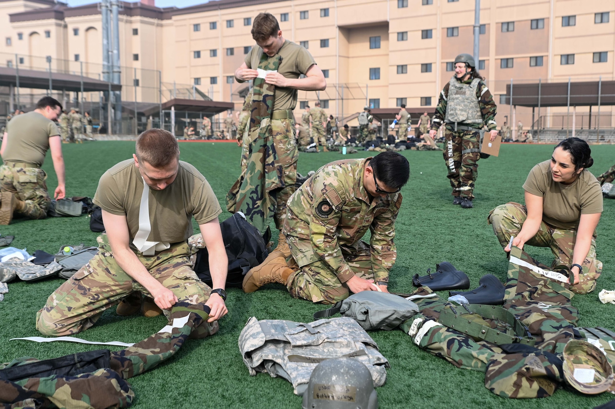 694th Intelligence, Surveillance and Reconnaissance Group Airmen mark chemical, biological, radiological, and nuclear gear during an Ability to Survive and Operate rodeo at Osan Air Base, Republic of Korea, April 26, 2024.