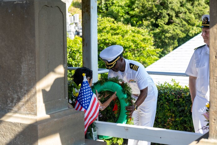 SHIMODA, Japan (May 17, 2024) Cmdr. Ron Jenkins from Columbia, South Carolina, the commanding officer of the Arleigh Burke-class guided-missile destroyer USS Higgins (DDG 76) receives a wreath to place on a tombstone during a memorial service at Gyokusenji Temple in Shimoda, Japan, May 17. The memorial service is part of the 85th Black Ship Festival commemorating the 171st anniversary of the arrival of Commodore Matthew Perry in Japan in 1853, a historical event that marked the beginning of diplomacy and trade agreements between the U.S. and Japan. Higgins is forward deployed and assigned to Destroyer Squadron (DESRON) 15, the Navy’s largest DESRON and the U.S. 7th fleet’s principal surface force. (U.S. Navy photo by Mass Communication Specialist 1st Class Hannah Fry)