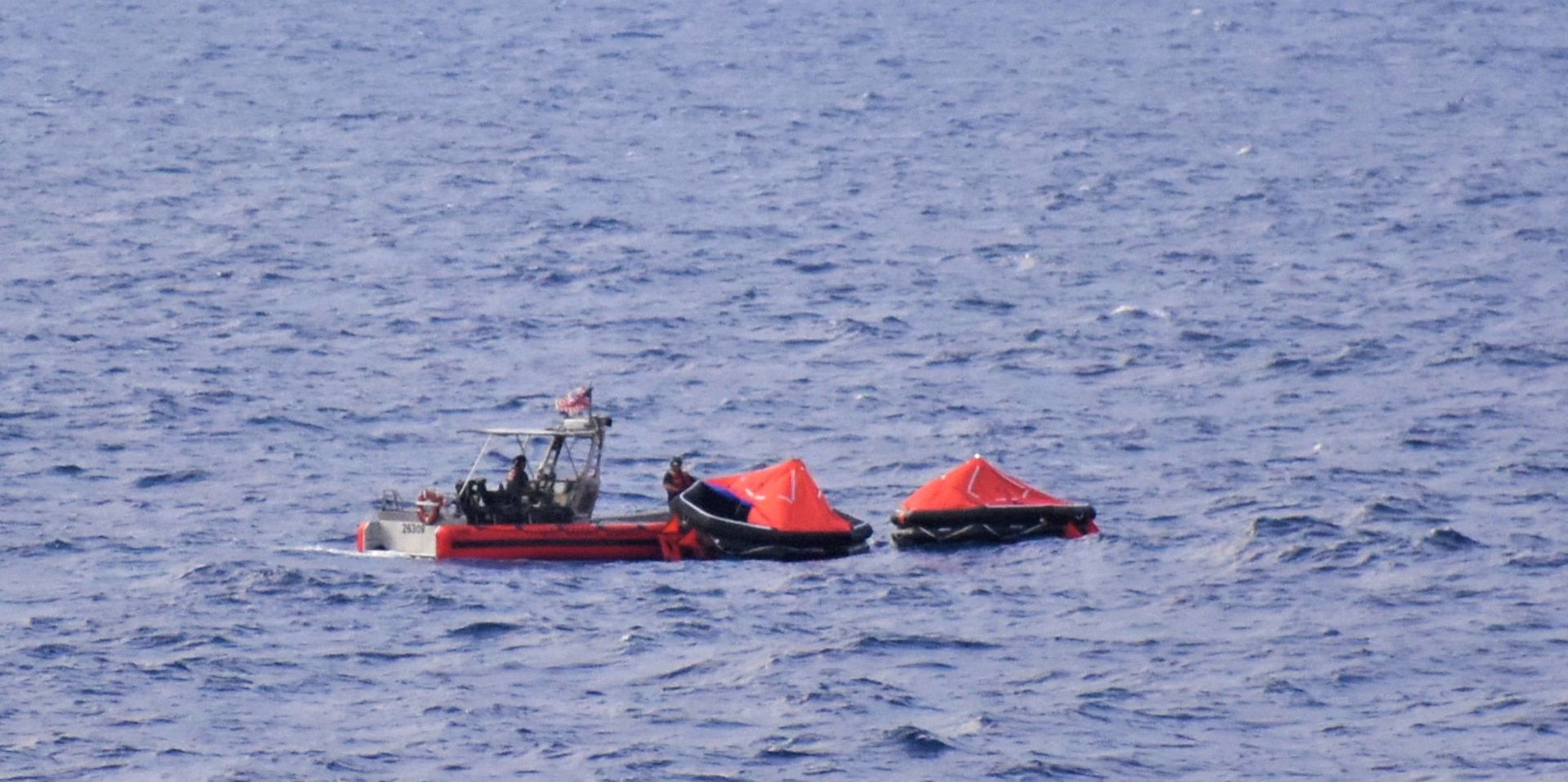 A USCGC Resolute small boat crew recovers two life rafts from the sunken 90-foot schooner De Gallant approximately 20 miles north of Great Inagua, May 21, 2024.