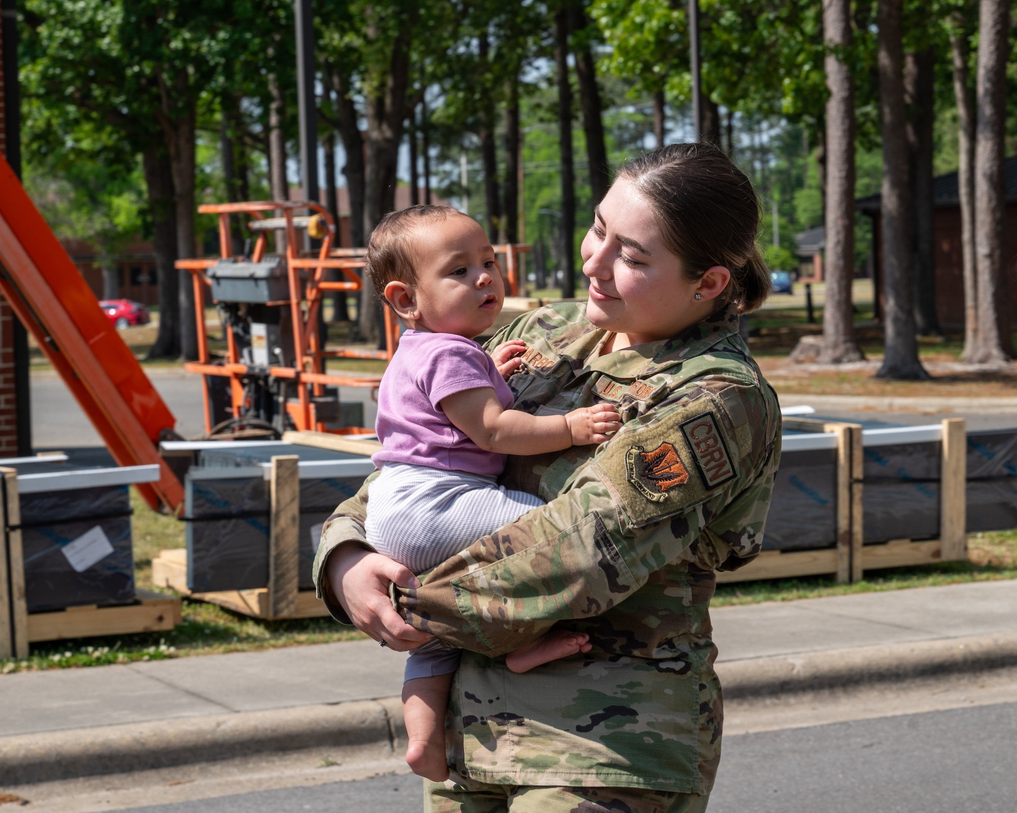 U.S. Air Force Staff Sgt. Samantha Barbour, an emergency management technician assigned to the 4th Civil Engineer Squadron, participates in the annual “Purple Up Parade” at Seymour Johnson Air Force Base, North Carolina, April 19, 2024. The parade recognized the resilience and strength of military children. (U.S. Air Force Photo by Airman Rebecca Tierney)
