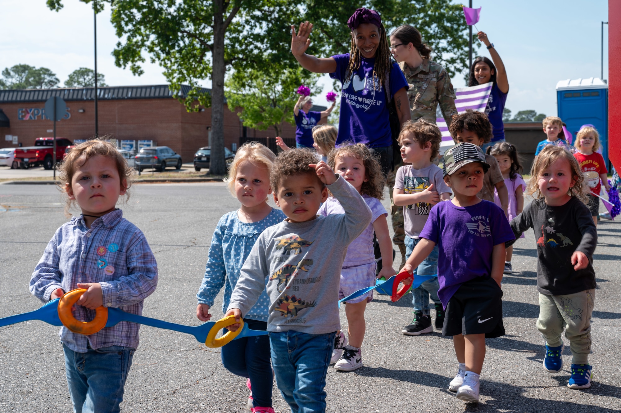 Children of the Seymour Johnson Child Development Center participate in the annual “Purple Up Parade” at Seymour Johnson Air Force Base, North Carolina, April 19, 2024. The color purple is used as a symbol of support and unity for all military children. (U.S. Air Force Photo by Airman Rebecca Tierney)
