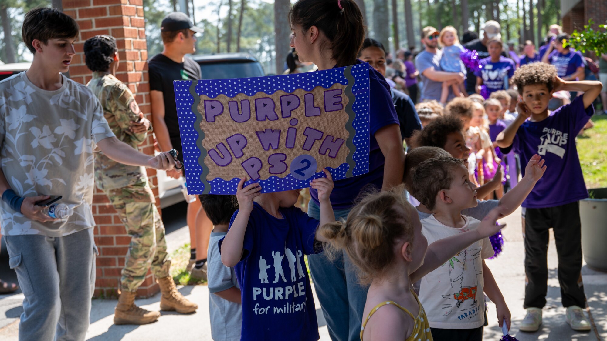 Children of the Seymour Johnson Child Development Center participate in the annual “Purple Up Parade” at Seymour Johnson Air Force Base, North Carolina, April 19, 2024. The color purple is used as a symbol of support and unity for all military children. (U.S. Air Force Photo by Airman Rebecca Tierney)