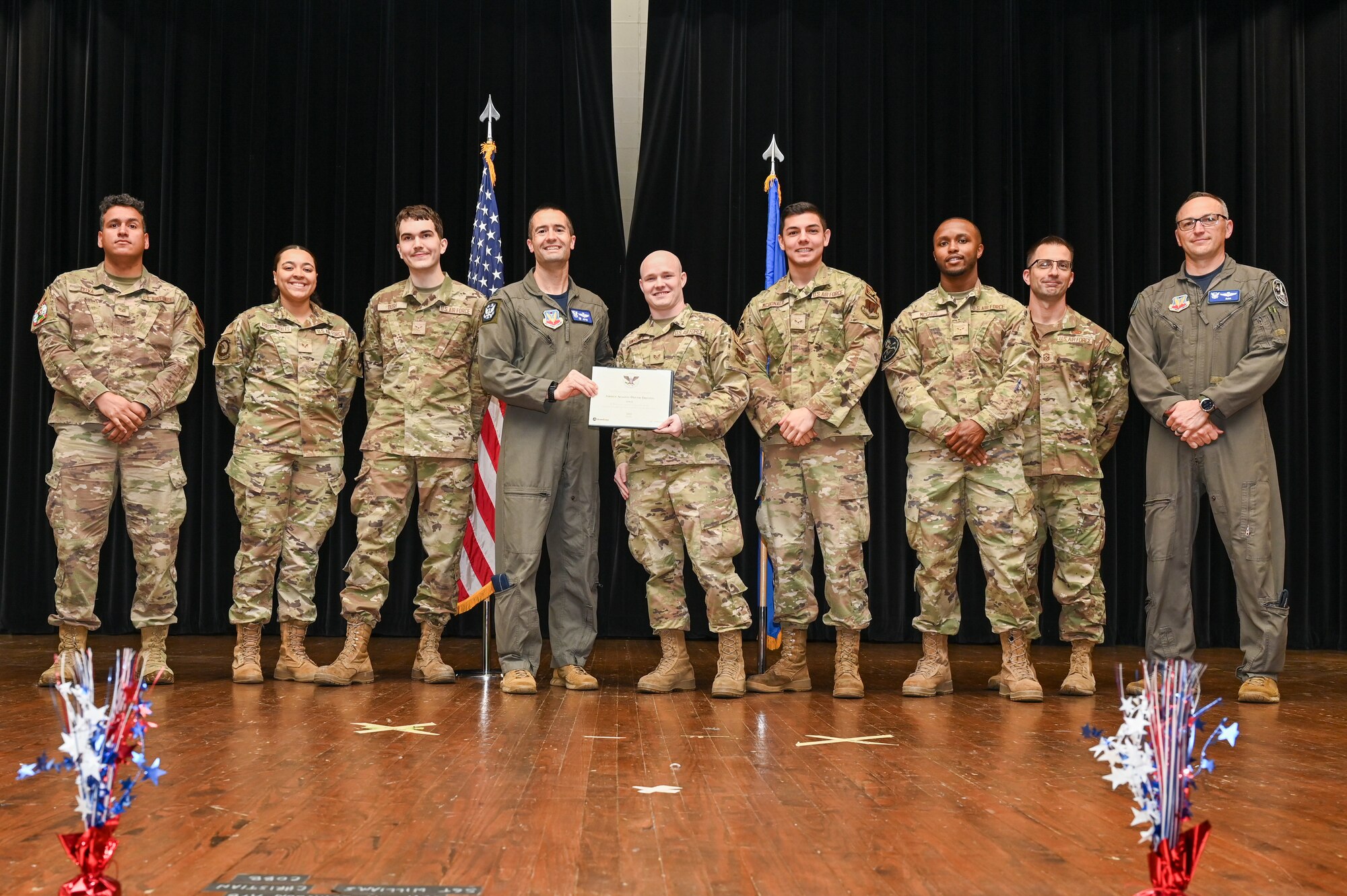 Col. Morgan Lohse, center left, 4th Fighter Wing commander, and Col. Steven Bofferding, right, 4th Fighter Wing deputy commander, present the Gold Presidential Volunteer Service Award to Seymour Johnson Air Force Base volunteers during a volunteer appreciation ceremony at Seymour Johnson Air Force Base, North Carolina, April 26, 2024. The Gold award winners have completed 250 or more hours for young adults, 500 or more hours for adults and 1,000 or more for families and groups. (U.S. Air Force photo by Airman Rebecca Tierney)