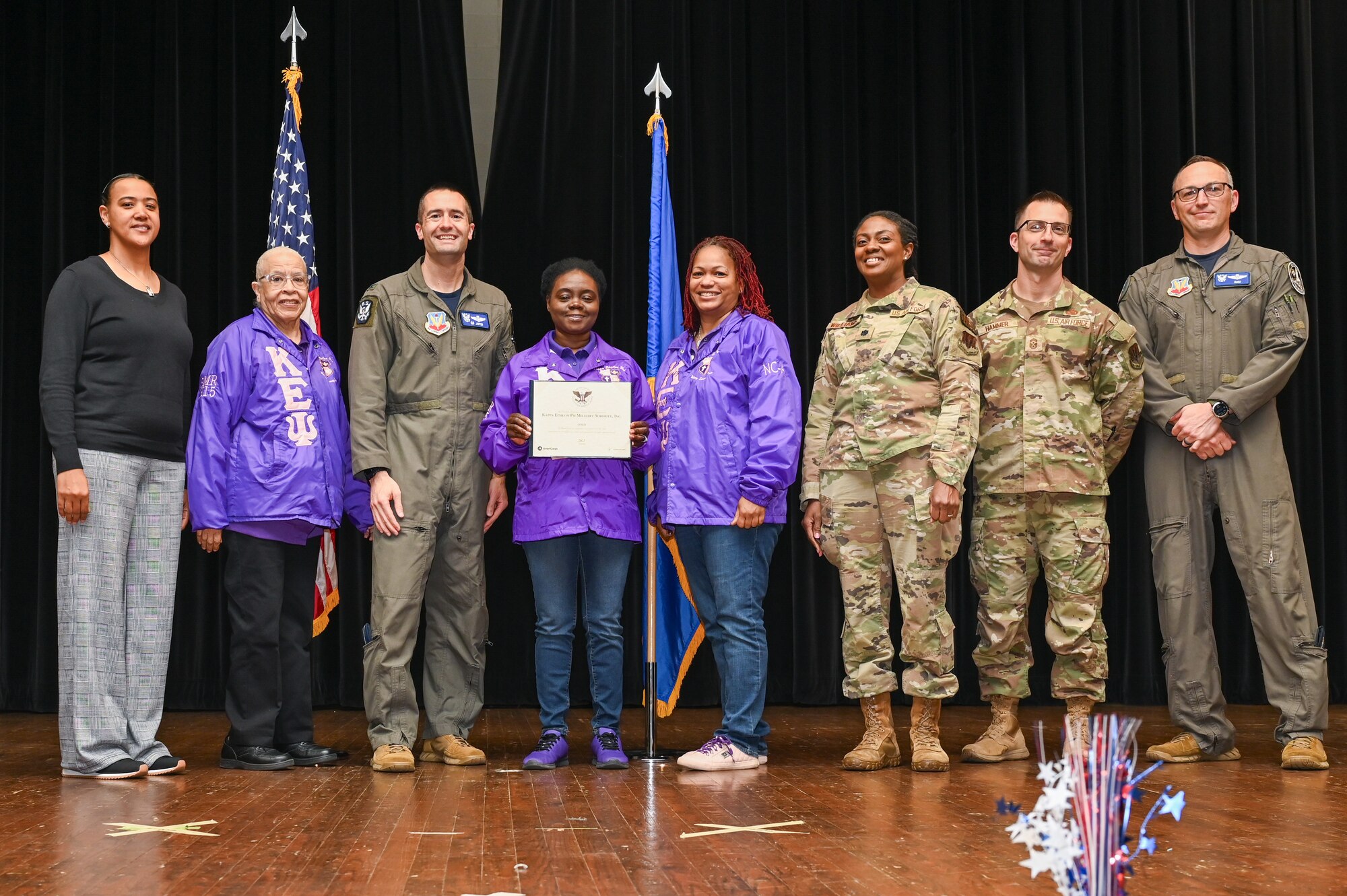Col. Morgan Lohse, center left, 4th Fighter Wing commander, and Col. Steven Bofferding, right, 4th Fighter Wing deputy commander, present the Gold Presidential Volunteer Service Award to Seymour Johnson Air Force Base volunteers during a volunteer appreciation ceremony at Seymour Johnson Air Force Base, North Carolina, April 26, 2024. The Gold award winners have completed 250 or more hours for young adults, 500 or more hours for adults and 1,000 or more for families and groups. (U.S. Air Force photo by Airman Rebecca Tierney)