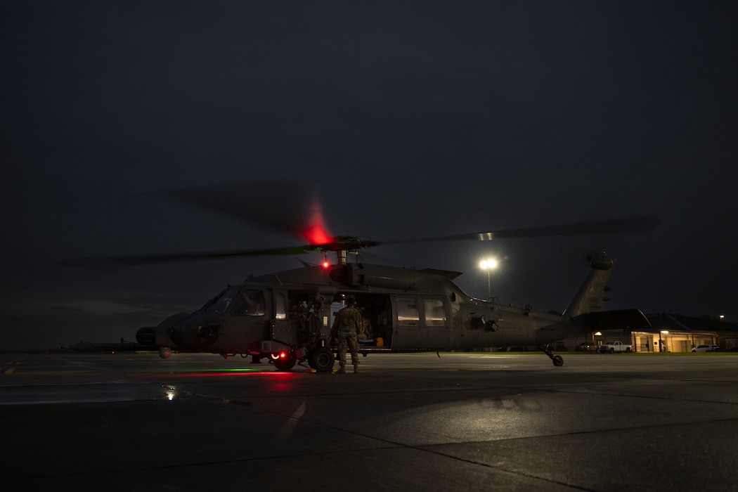 A photo of a helicopter on a flightline.