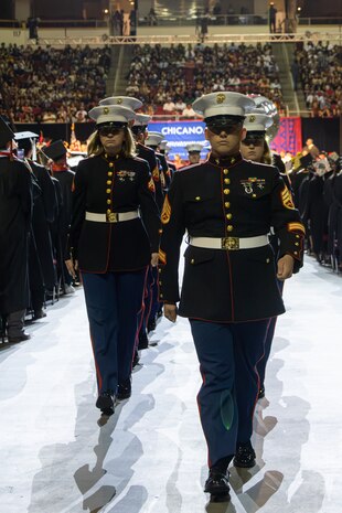 U.S. Marines assigned to Marine Band San Diego march away from the stage after their performance during the 48th annual Chicano/Latino Commencement Celebration at California State University, Fresno, Calif., May 18, 2024. Chicanos and Latinos make up 58-percent of graduating students in the CSU system, many of them being first-generation students. (U.S. Marine Corps photo by Cpl. Bruin Largent)