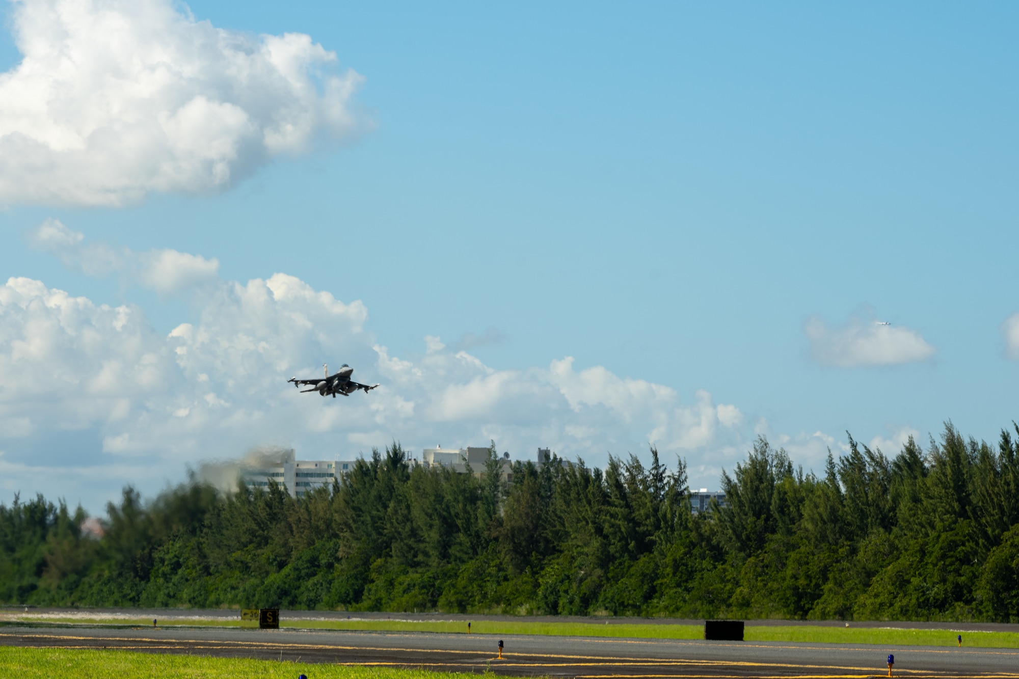 An F-16 takes off from the flightline