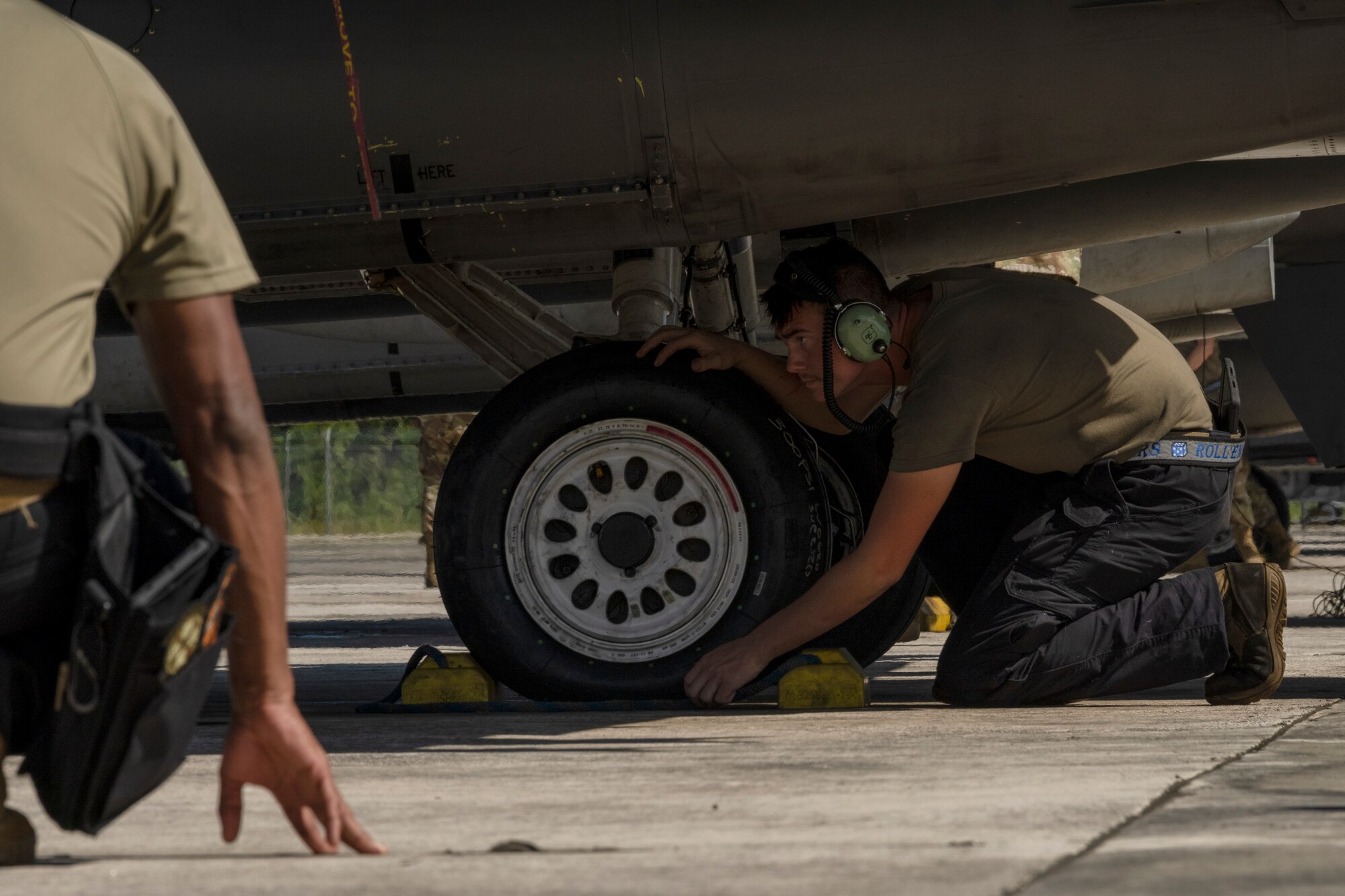 Airmen prepare an aircraft for takeoff.