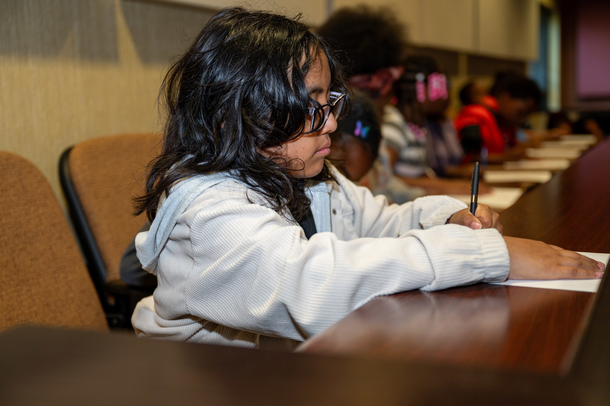 Children from the local community act as a jury during a mock trial at Seymour Johnson Air Force Base, North Carolina, May 2, 2024. The interactive trial followed a fictional case of stolen candy in which the children were asked trivia questions regarding their knowledge of the justice system. (U.S. Air Force Photo by Airman Rebecca Tierney)