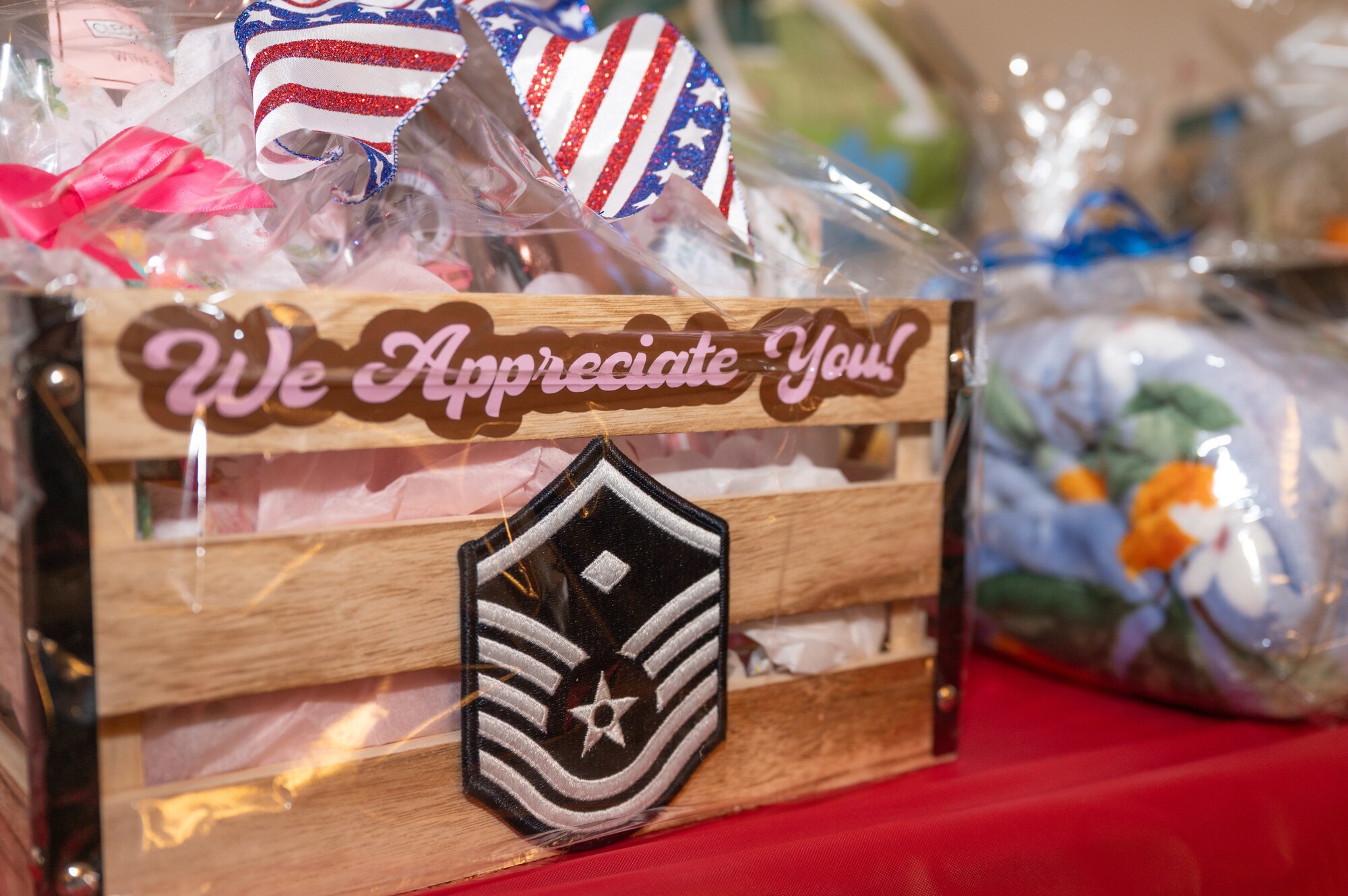 A gift basket is presented at a Spouse Appreciation Week dinner event at Seymour Johnson Air Force Base, North Carolina, May 10, 2024. The dinner was held in honor of Spouse Week, in which spouses are recognized and appreciated with different events on base. (U.S. Air Force Photo by Airman Rebecca Tierney)